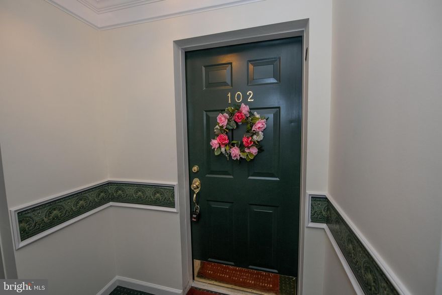 **Welcome to easy, elegant living in the heart of beautiful Warrington! This lovely 1st floor 55+ condo offers the perfect blend of comfort, convenience, and low-maintenance living. Step inside through the welcoming entry foyer featuring a spacious coat closet and beautiful engineered hardwood flooring throughout the main living areas.

**The bright and inviting living room is adorned with beautiful windows and sliding doors leading to your private patio overlooking the professionally landscaped backyard — the perfect place to enjoy your morning coffee or unwind at the end of the day. The spacious eat-in kitchen features a large breakfast bar, ample cabinetry, and plenty of room for everyday living and entertaining.

**You will also love the versatile den with French doors and a lighted ceiling fan, ideal for a home office, reading room, or guest space. The generously sized primary suite features a walk-in closet, additional closet space, lighted ceiling fan, and an attached bath complete with double vanity sinks, ceramic tile stall shower, and linen closet. A comfortable second bedroom with carpeting and lighted ceiling fan, along with a second full hall bath, provides plenty of space for guests.

**Ideally located near shopping, dining, parks, and major roadways, this home makes everyday living simple and enjoyable. Whether you are downsizing or starting your next chapter, this warm and welcoming home is ready to impress. Come experience the charm, comfort, and convenience that make Warrington such a sought-after place to call home!
