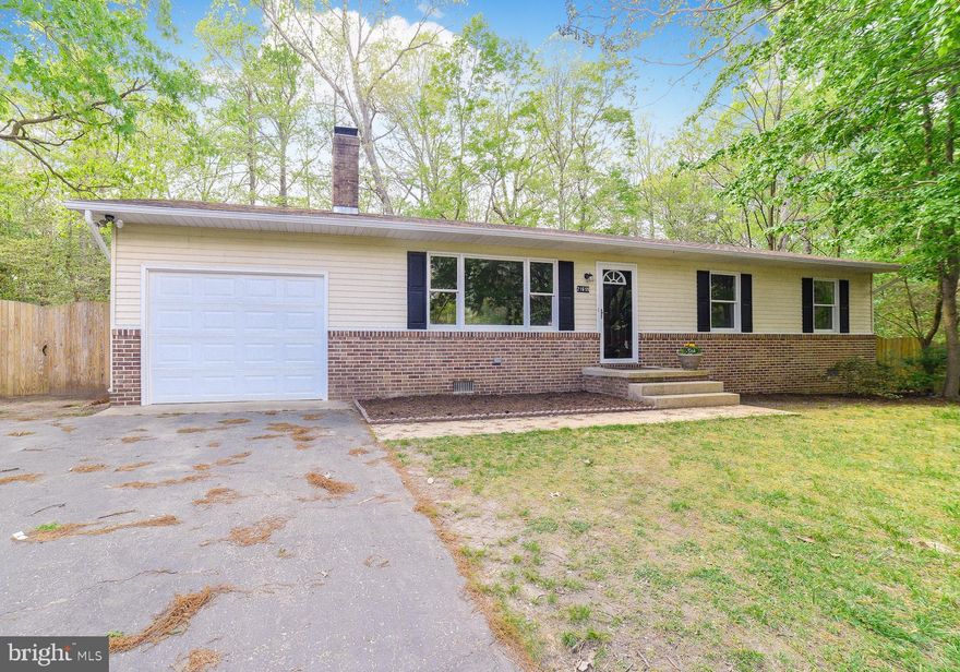 Spacious 3 Bedrooms, 2 bathrooms,  woodburning fireplace in living room, kitchen w/new cabinets, SS appliances, granite counter tops, & recessed lights. freshly painted, new floors, new deck, fenced backyard and 1 car garage.