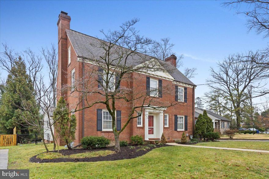 Welcome to this stately brick colonial  in the heart of the Aurora Hills Neighborhood on one of the mostdesired picturesque streets.  This home rests  on one of the rarely available lots backing  up to wooded parkland  full of natures glory.  Enjoy all of the urban conveniences nearby while also having  an incredible view of a tranquil environment.  The backyard hosts  a small pond/water feature, patio,  and mature vegetation.  As you step inside  the front door you will find yourself in a welcoming traditional foyer.  The eat in kitchen and baths are full of modernized details, counter tops and tile .  The  kitchen appliances and first floor stacked laundry are new.  The first floor bedroom suite has a private rear entrance to the back yard. This area may be utilized to age in place, host guests or in laws,  a nanny quarters or a first floor family room.   The upper level  has  a spacious owner's bedroom with an on suite bath, 2 more generously sized secondary bedrooms  and another full bath.  The basement has crisply  painted walls and vinyl flooring,  a wood burning fireplace, guest area and another full bath along with a second laundry/utility with an exterior door leading to the back yard.  Hardwood and tile floors throughout the first and second floors and modern vinyl plank in the basement area.  Kitchen Cabinets custom painted in a modern gray and topped with high end leathered granite counters.  Enjoy the spacious living room, den/office and light filled dining room with charming built in cabinets to fill with all of your special things.