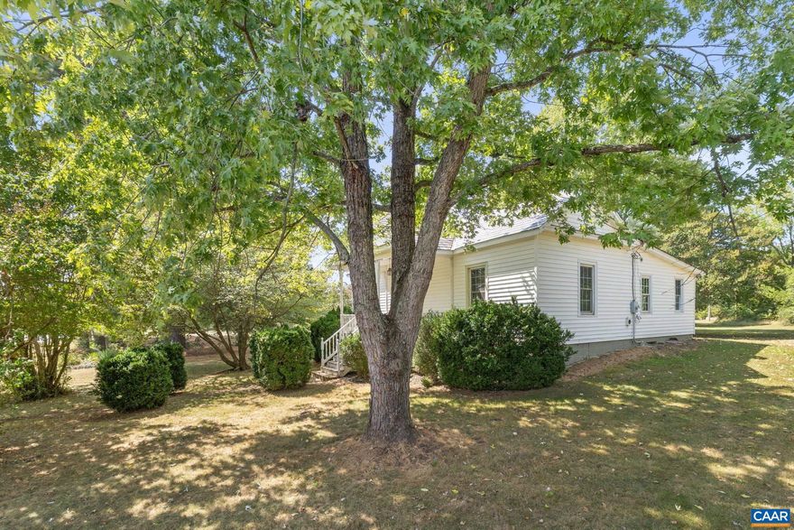 AFFORDADBLE COUNTRY CHARMER.  This adorable bungalow offers the perfect blend of charm and modern convenience, ideally located just 5 miles south of the James River and minutes from Fork Union. The home welcomes you with soaring 10-foot ceilings, sun-filled living spaces, and a blend of hardwood and ceramic tile floors. A cozy sunroom provides the perfect retreat, while modern updates?including new insulation, a high-efficiency heat pump with central air, updated windows, and complete re-wiring and plumbing?ensure comfort and energy savings. The kitchen showcases rich cherry cabinetry, striking soapstone counters, and generous storage, while the bathrooms feature beautiful ceramic tile finishes. Outside, enjoy the quality of the slate roof, the original storage shed set on a slate foundation, along with fruit trees and a garden area. Convenient to Dillwyn and just 45 minutes to Charlottesville, this property is a wonderful mix of timeless character and modern living.,Cherry Cabinets,Tile Counter,Fireplace in Living Room
