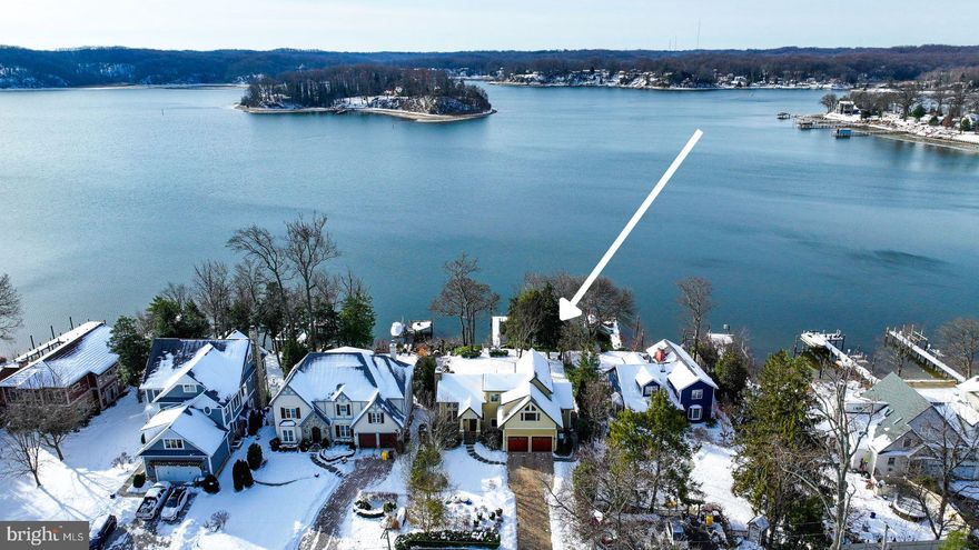 This exceptional waterfront property is situated on a peninsula, offering breathtaking water views from both the front and back of the home, including stunning vistas of Little Round Bay and St. Helena Island. The two-car garage features beautiful mahogany doors and is equipped with an EV charger, ample storage space, and durable poly-coated flooring.

Inside, the great room impresses with soaring cathedral ceilings, an open staircase, beautiful hardwood floors, and a cozy wood-burning fireplace with gas logs. The gourmet kitchen is designed for both style and functionality, featuring a large granite island with built-in appliances, custom cabinets, and a walk-in pantry. The home offers three spacious bedrooms, each with custom walk-in closets, and luxurious bathrooms.

The expansive basement is a blank canvas with 12-inch-thick foam-core walls, a sump pump, plumbing for an additional bathroom, and endless potential for extra living or recreational space. This meticulously built home includes foam insulation, Hardie Plank siding with Azek trim, a mahogany front door, geothermal heating and cooling, a Hoot Owl septic system, a 500-gallon propane tank, a 20KW generator, a high-recovery 50-gallon hot water heater for continuous hot water, and 50-year  shingles.

The outdoor space is equally remarkable, with a beautiful driveway with pavers, an expansive Azek deck overlooking the water, and professionally landscaped front and back yards with an irrigation system. A tram leads down to the dock, a boat lift for vessels up to 10,000 pounds, a floating slip accommodating  a 30 to 40 foot long boat, and a dock de-icer. This home is the perfect blend of luxury, craftsmanship, and serene waterfront living.  Don’t miss this rare opportunity to live on Long Point on the Severn.

* $25 Annual Fee for Civic Association for Long Point *