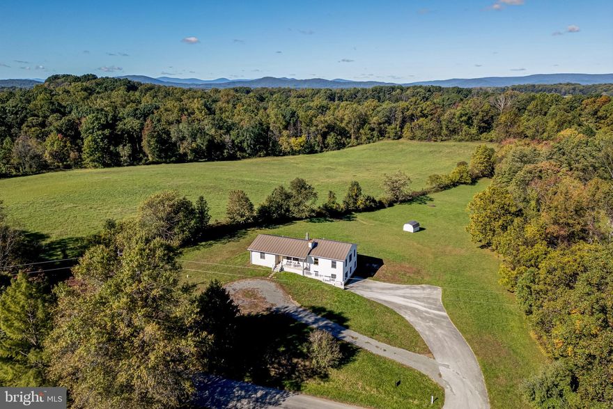 A rare find in a quiet rural setting on 5+ acres, yet minutes from Marshall, The Plains and Route 66. Essentially a new house (added to original 80s era) in superb condition, very solid construction with 2/3 bedrooms, 2 full baths, large, open, sunny kitchen family area, wood burning fireplace, mud room, storage, office area. High quality appliances and finishes throughout. Lower level guest suite or primary bedroom. Great protected northern Fauquier location.