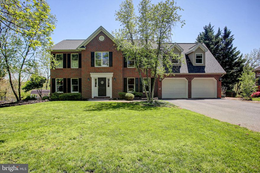 Tucked within the highly sought‑after Greencastle Greens community, this custom‑built Colonial offers over 4,000 finished square feet designed for comfortable everyday living and effortless entertaining. The main level features soaring ceilings in the family room, a formal living area with a gas fireplace, a spacious dining room, and a beautifully crafted cherry kitchen. A private office with custom built‑ins overlooks the tranquil backyard - an ideal work‑from‑home setting. Off the kitchen and family room, a large covered deck extends the living space and leads to the backyard oasis.
Upstairs, the generous primary suite includes an updated tile and quartz bath and an impressive walk‑in dressing room with custom built‑ins and a center island. Three additional large bedrooms and a full bath with a walk‑in shower and soaking tub complete the upper level. The finished, walk‑out lower level adds even more living space with a theater room with fireplace, game room, and plenty of room for activities.
Outdoor living is exceptional on this 0.60‑acre property! Enjoy evenings in the custom outdoor kitchen - complete with built-in grill, fridge, ample seating, and an outdoor TV - or practice your putts on your private putting green. A path leads directly to Muddy Run Stream and offers views of the adjoining Greencastle Greens Golf Course. Mature trees, extensive landscaping in the front and backyards, and beautiful views throughout the property make this home truly stand out.