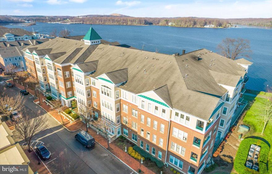 Unobstructed Water Views from this bright, beautiful penthouse level condo with 2 bedrooms and 2 full baths. Live & entertain comfortably in this open floor plan. Large windows in the bedrooms invite tons of natural light. Kitchen opens to dining area. Master bedroom features a large walk-in closet & spa-inspired bathroom. Second bedroom plus full bath & full laundry. Balcony with unobstructed views of the water! Meticulously maintained. 2 assigned, underground parking spaces just feet from the elevator, plus very rare walk in storage unit on the same level of the home. Two garage spaces will also convey. Private fitness center in building. Belmont Bay is a community rich in amenities: swimming pool, tennis courts, private boat marina, kayak club, and the Osprey's event center. Miles of walking, jogging & biking trails along the water and exceptionally well-maintained greenspace areas. VRE commuter railway station, bus stop, and free commuter parking garage located in the community too as well as local elementary school & George Mason Science Center. Close to major commuting routes! Move-in just in time for upcoming neighborhood summer concert series at the marina! Historic town of Occoquan & Stonebridge Town Center just minutes away. Why vacation? You'll live it here everyday!  Live & play in Belmont Bay, one of the most unique waterfront communities in the region!