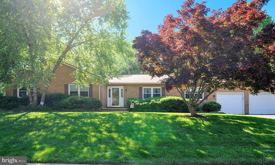 Here's your chance to own a home in Quailwood. One level living at its best.  Gorgeous brick front home on a corner lot. Hardwood floors in foyer, half bath, living room and dining room. Wood laminate flooring in hallway and master bedroom.  Skylights brighten the kitchen, family room and sunroom.  Updated, light filled kitchen with granite counter tops, cherry cabinets and new stainless steel appliances.  Bright and airy family room is open to the kitchen.  Large master bedroom with updated master bathroom with tile floor, granite counters and custom shower with beautiful inset Spend a delightful summer relaxing in the sunroom or on the double decks enjoying your private back yard.  Winters will be cozy beside the brick fireplace with pellet stove insert.  There is also two car garage with workbench.  This house has it all!  Don't wait!