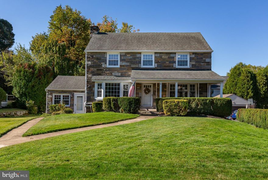 Welcome to this stunning stone colonial home located in the desirable North Aronimink area of Havertown that is priced to SELL! This impressive residence boasts over 3,000 square feet of living space, featuring generously sized rooms, multiple bedrooms and bathrooms, and modern updates throughout.  Improvements include a newer roof and windows, an updated kitchen and bathrooms, and beautiful hardwood flooring. The property also offers a private driveway with ample off-street parking, central air conditioning, and gas heating. A unique highlight is the separate office attached to the home, complete with its own private entrance, making it ideal for professionals such as dentists, lawyers, insurance brokers, or accountants. (You must live in the house in order to use the office.) As you enter through the front porch, you are greeted by a spacious foyer that leads to a cozy living room with a fireplace on the left and a formal dining room on the right, both adorned with bay windows that fill the space with natural light. The updated kitchen features stainless steel appliances, tile flooring, new granite countertops, and abundant cabinet space, while a convenient powder room, a first-floor laundry room, and a family room with built-ins and another bay window complete the main level. Upstairs, the large primary bedroom includes a newly renovated bathroom, alongside three additional spacious bedrooms and a modern hall bath. The finished basement offers a versatile area that can serve as a family room, home gym, or additional bedroom, complete with a full bathroom, laundry room, and a fully equipped kitchen, making it an excellent in-law suite with its own walkout entrance. Additional amenities include a lawn sprinkler system, a walk-up attic for extra storage, and an attached garage. This property is a rare find, perfectly situated near schools, shopping, public transportation, and just 20 minutes from Center City Philadelphia. Be sure to review the attached floor plans and seize this incredible opportunity!