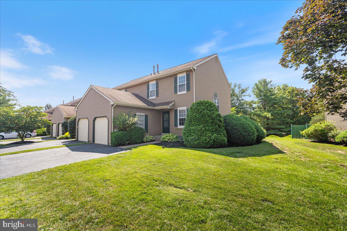 Welcome to effortless, move-in-ready living in this beautiful end unit townhouse in the desirable Heacock Meadows community. From the moment you enter, the functional layout impresses with a welcoming entry hall flanked by a dedicated home office, a half bath, and convenient garage access. Continue onward into the open-concept main living space, where a stunningly renovated kitchen serves as the heart of the home, featuring antique-white slow-close cabinetry, a versatile angled island with seating, pristine granite countertops, and a full suite of stainless steel appliances. This inviting area flows seamlessly into the dining room, where beautiful French sliding glass doors open to a private fenced courtyard, and connects to the living room, centered around a cozy marble-surround wood-burning fireplace. Durable and stylish luxury laminate/vinyl flooring runs throughout all three levels, creating a cohesive and modern look. The upper level continues to impress with two large bedroom suites, each boasting its own private, updated bathroom. The primary suite is a true retreat, featuring a second wood-burning fireplace and an expansive walk-in closet. A conveniently located laundry room, accessible to both bedrooms, completes this level. For even more living space, the fabulous finished lower level offers a versatile family room perfect for media or recreation, providing significant bonus square footage not included in the official 1,418 sq. ft. All hi-hats have LED bulbs. A standout feature of this home is its flexible layout; PLEASE NOTE: this two-bedroom floor plan offers the exact square footage of the neighborhood's three-bedroom model, and the oversized second bedroom can be easily converted to create a true three-bedroom home if desired. Enjoy a low-maintenance lifestyle with resort-style amenities including a pool, tennis courts, and clubhouse, with community-maintained lawns freeing you to explore the charming local stores and restaurants just a short walk away. This prime location is just a short walk to charming local stores and restaurants and offers easy access to major highways and trains to the Philadelphia, Princeton corridor, and NYC. Confidence in your purchase is assured thanks to major recent upgrades, including new windows and a completely new furnace and AC, all luxury laminate/vinyl throughout the townhome - all 3 levels. This exceptional and thoughtfully updated property is ready to be called home.