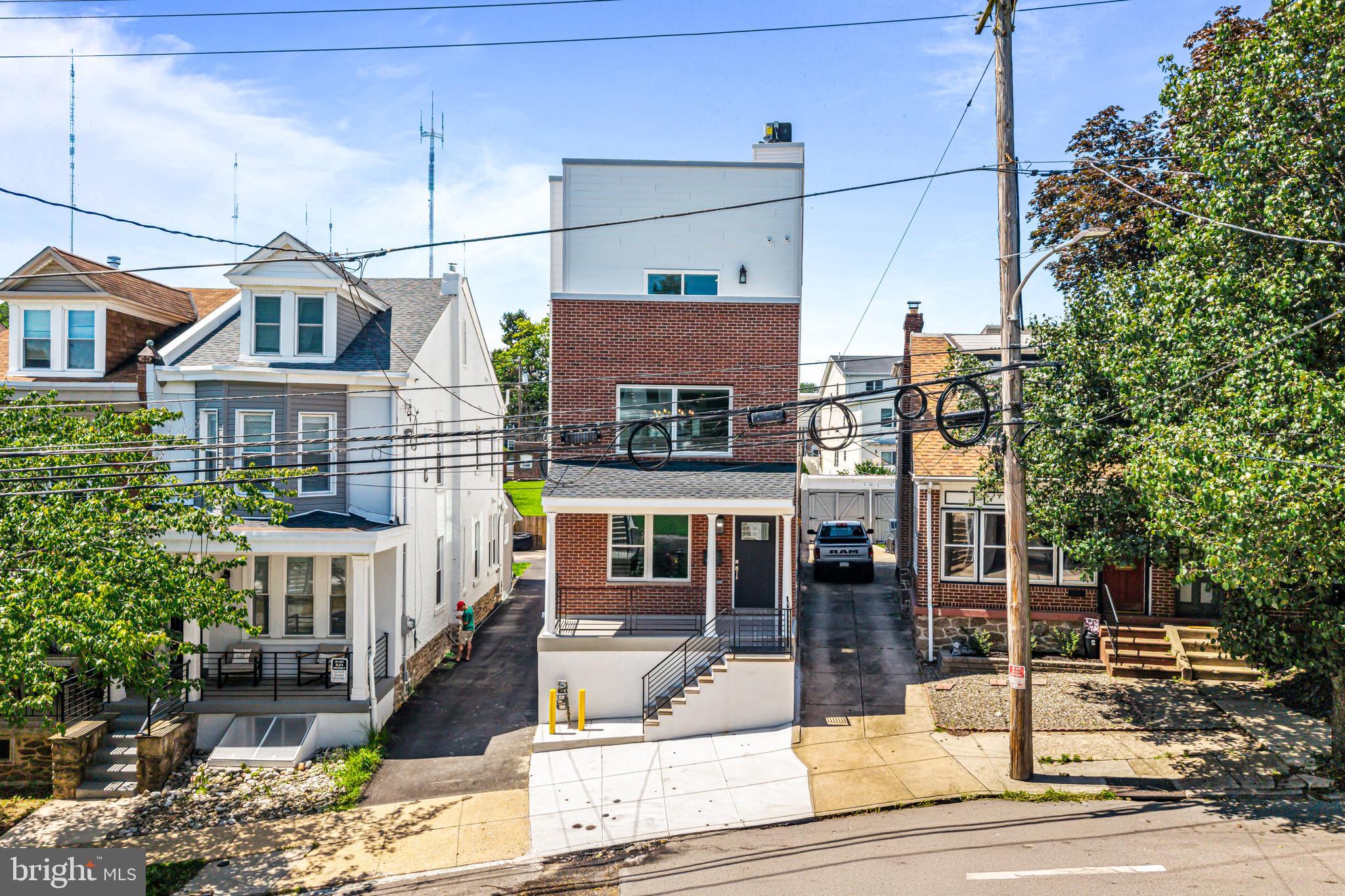 Welcome to your future dream home in the vibrant Roxborough neighborhood of Philadelphia! This stunning new construction gem offers a rare combination of luxurious space and smart design, boasting an impressive 3,773 square feet. Nestled away on a quiet street, this residence provides a serene retreat while keeping you close to everything that makes Roxborough one of Philly’s most desirable areas.
As you step inside you will immediately be in awe by the living room area which has soaring 20-foot ceilings featuring a caulford design. This space is also flooded with natural light and exudes an open and airy feel throughout which makes it the perfect space to entertain friends and family for special gatherings. The oversized 2-car garage is a rare city find, offering ample room for vehicles, bikes, and storage. The drive way which wraps around to the back of the house has room for about 3-4 extra cars. Head downstairs to find a fully finished basement—the perfect flexible space for a home gym, office, or media room. Whether you're entertaining guests or seeking a peaceful escape, this home delivers. There are dual HVAC systems, one in the basement and one on the third floor to guarantee climate control throughout the seasons.
As you ascend to the second floor you will find the show stopper of a kitchen! This is every chef's dream kitchen, which has endless amounts of cabinet and counter top space for all types of culinary activity. You will also find top of the line stainless steel appliances such as a French door refrigerator, 6 burner gas cook top, built in convection double wall oven, dishwasher, and built in microwave drawer. Tucked away and adjacent to the kitchen is a pantry room which is equipped with its own mini wine refrigerator to keep your beverages cold for delicious meals. To top everything off on this floor is an enormous balcony where you can enjoy the beautiful weather during those unforgettable summer nights.
Heading up to the third floor is where the three large bedrooms, hall bath, and laundry hook ups are located. Each bedroom is equipped with their own personal closet. The front bedroom has its own private balcony which over looks the front of the property and is a perfect little retreat to enjoy the peace and quiet of the outdoors just steps outside your bedroom. The hall bath features a tub/shower, toilet, and beautiful vanity. The main bedroom boasts two walk in closets, their own private bathroom, and tons of natural light flooding in from windows on two different walls in the room. You are going to be blown away by the luxurious main bathroom this home has to offer. The walls are fully tiled from the floor to the ceiling, the vanity features double sinks and tons of storage space, and the shower stall has two shower heads for the ultimate shower experience.
Just when you thought there couldn't be more there is a panoramic rooftop deck which gives you some of the best views in the city.
This property also features a 10-Year Tax Abatement, providing excellent long-term savings, and comes with both a 1-Year Builder Warranty for extra peace of mind.
Just steps away from trendy cafes, award-winning restaurants, boutique shops, and the regional rail, you’ll have effortless access to Center City and beyond. This is more than a home—it’s a lifestyle upgrade.
Coming soon—don’t miss your chance to own a stunning new construction in the heart of Manayunk!