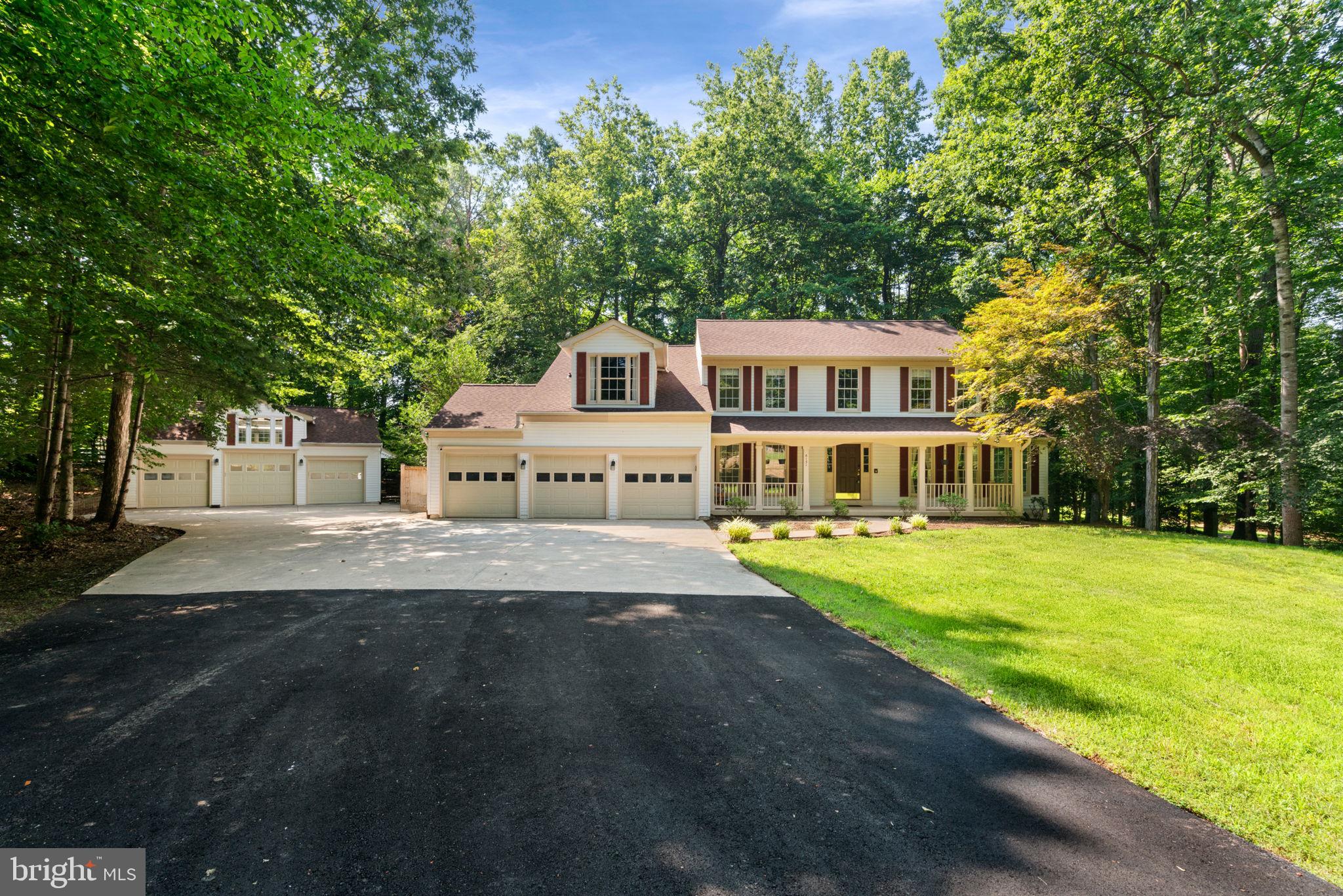 Gearhead’s Dream with a Gorgeous Traditional Home to Match – 6 Garage Bays, Lift, Tool Storage, and More!
Car enthusiasts, hobbyists, and collectors— your ultimate garage sanctuary awaits! Tucked into a peaceful, no-HOA setting, this spacious 4,130 sq ft home comes with not just one, but two incredible garages totaling 6 bays, featuring over $40,000 in premium garage equipment.
The attached three-car garage is outfitted with a high-end Prevost K1322TS wall-mounted pressure washer system by Obsessed Garage, built-in workbench and shelving, an extra fridge, a full speaker system, conveying exercise equipment and each door has it's own garage door opener. To the left side of the property, the detached three-car garage is a showpiece of its own, with a soaring 12'9" center ceiling that accommodates a two-post, MAPPS hydraulic lift and a 9'8" oversized door with a direct-drive opener. This garage also includes upgraded lighting, a dedicated 60-amp electrical subpanel, and over $30,000 in professional-grade SONIC Tools cabinets and toolbox systems.
Inside, the home features a two-level foyer, updated lighting, original hardwood floors on the main level, and new carpet in the formal living room, formal dining room, and both main-level offices. The kitchen is equipped with stainless steel appliances, a large walk-in pantry with access to the attached garage, and opens to a step-down family room with a wood-burning fireplace. From the family room access the expansive rear deck—including a screened-in porch with a conveying inflatable hot tub—make this home ideal for indoor-outdoor living. The fully fenced backyard offers three access gates, one leading to the front yard, one to the side yard near the detached garage and one on the opposite side of the home.
Upstairs, you’ll find four generously sized bedrooms, all with brand new carpet. The primary suite is a true retreat, with a spacious bathroom offering dual vanities, a large soaking tub, stand-up shower, and private toilet room with direct access to the walk-in closet. The massive closet includes extensive built-in shelving and its own laundry area. A shared hall bath with dual vanities and a tub/shower combo serves the remaining bedrooms.
The unfinished basement includes a rough-in for a full bath, and both the workbenches and weightlifting equipment convey. Major updates include a new roof, new asphalt driveway and over 2,700 square feet of additional concrete parking, HVAC (2021), a brand-new $35,000 well, water heater (2023), pressure tank (2024), water softener and filtration system (2023), and a radon remediation system. The septic system has been regularly maintained and was last pumped in 2024. The whole-house vacuum system conveys as-is, along with a (as-is) riding lawnmower stored in the shed behind the detached garage. With no HOA, ample parking, and unmatched garage amenities, this one-of-a-kind property offers the perfect combination of comfort, space, and functionality for those who live life in the driver’s seat.