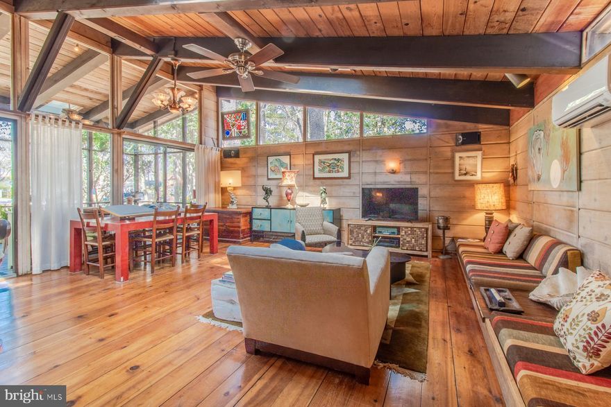 Imagine stepping back into the golden era of beach living at 124 Jersey Street—an exceptionally rare Fee Simple opportunity in Rehoboth by the Sea just two blocks from the ocean.
Originally built as a quintessential North Dewey beach retreat, this classic 3-bedroom, 2-bath Windjammer cottage has been thoughtfully improved while preserving its authentic coastal character. In 2021, the property underwent significant structural enhancements, including lifting of the home by East Coast Structural to allow for the addition of a full foundation and insulated crawlspace. Major infrastructure improvements were completed at that time, including new plumbing, updated electrical systems, ductless mini-split HVAC, new siding and upgraded insulation—capital improvements that provide both peace of mind and long-term durability.
The home is further complemented by its distinctive and durable red metal roof, adding both architectural charm and practical longevity to this timeless coastal property.
Inside, the home features an inviting, airy layout designed for relaxed coastal living, with numerous gathering spaces ideal for entertaining after a day on the beach. The kitchen has been updated with new appliances and countertops, while outdoor spaces include spacious decking, dramatic lighting, lush landscaping, and multiple entertaining areas perfect for summer evenings, morning coffee, or casual gatherings with friends and family.
In a community largely comprised of land lease properties, fee-simple opportunities within Rehoboth by the Sea are limited and rarely available, providing long-term security, flexibility, and freedom from annual ground rent.  Ideally located just steps from the beach and Dewey Beach’s vibrant dining, nightlife, and coastal attractions.  Take a walk to local favorites like the Starboard, Bottle & Cork, or Woody’s for their famous crabcakes. Downtown Rehoboth’s boutique shopping and award-winning restaurants—including Back Porch Café, Fable, and Henlopen Oyster House—are just a mile away. Park the car, hop on a bike, or catch the Jolly Trolley and enjoy the best of coastal living.
Whether enjoyed as a nostalgic personal retreat, income-producing rental, or strategic long-term investment, the property offers compelling future potential in one of coastal Delaware’s most sought-after beach communities.