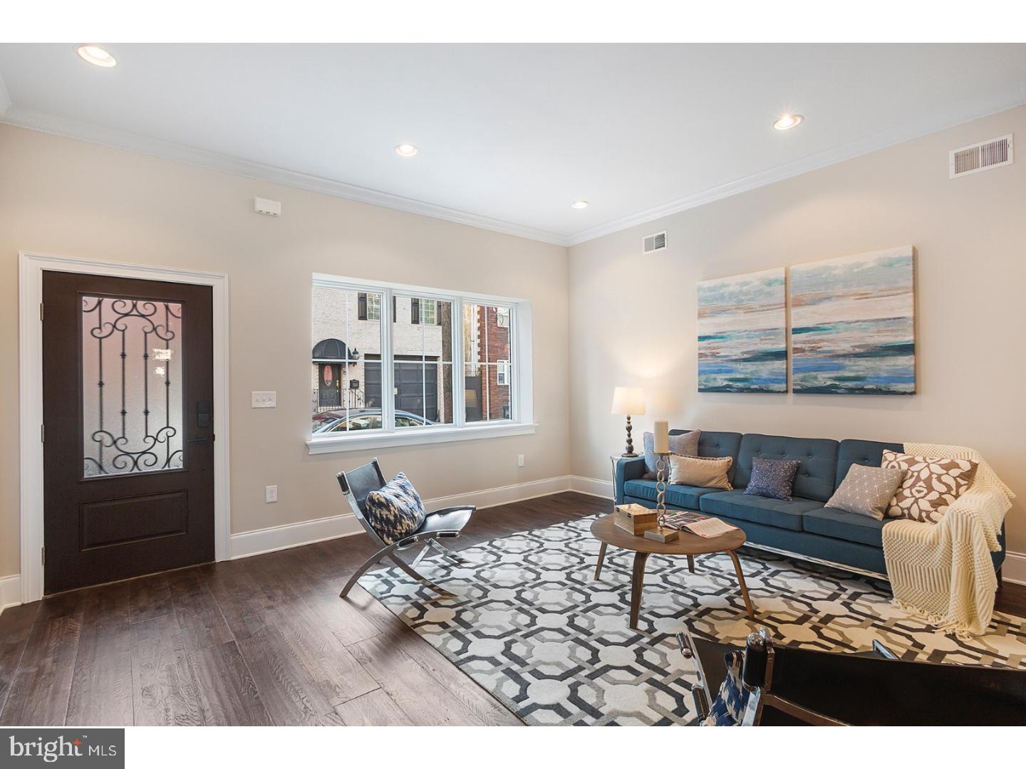 Welcome to 742 S 9th Street, a brand new, extra wide HUGE renovation in the heart of Bella Vista with a 10-YEAR TAX ABATEMENT*, just steps away from Palumbo Rec & Park at the corner, the Italian Market and Center City. This home consists of a total of approximately 3,000 square feet (including basement)3 Bedrooms, 3 and a half baths and a Dual Zone HVAC System. The front brick facade and stone was restored to maintain it's elegance. Pella pro-line windows are throughout the home. The gourmet chef's kitchen is modern, yet classic, with white shaker cabinets, super-white quartzite countertops, a 36" Bertazzoni Range with a wall hung range hood, a built-in Sharp microwave drawer and a dual zone wine cooler to store your favorite bottles. Downstairs is a finished, porcelain tiled basement, with closets for storage and a half bath for convenience and your guests. Wide plank distressed oak floors are on each floor above ground and each bedroom has it's own private ensuite bathroom and plenty of closet space! The third floor consists of a private master suite with a tray ceiling in the bedroom, a HUGE walk-in closet, luxurious master bath containing a double vanity with Carrara marble top, and huge frameless glass door shower with a shower head, wand, rain head and a free standing soaking tub! Head up the stairs to the fiberglass roof deck to see amazing city skyline views! This home is just steps away from some of the best amenities Bella Vista has to offer, including, the Italian Market, The Fitzwater Cafe, Morning Glory, Sarcone's Bakery, Ralph's Italian Restaurant and just a short walk to Center City! Schedule your appointment today! With a "WalkScore" of 98, 742 S 9th Street is in a super convenient location to run all of your daily errands within walking distance, while still painting close proximity to public transportation.