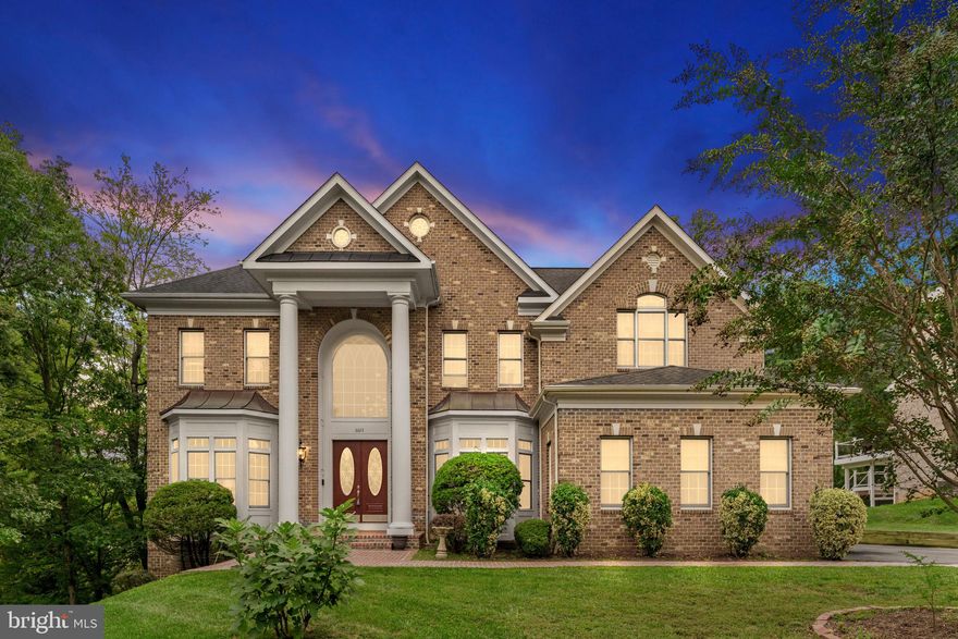 Welcome to your new home where attention to detail meets luxury and elegance!  This stunning custom build has so many great features including an all-brick elevation, 28-foot ceiling in the family room area, enormous primary suite, main level bedroom and full bathroom and much more!  Location is key in this highly desired neighborhood!  In close proximity to Braddock Road, 495 Beltway, route 66, route 50, and minutes away from Washington D.C.

As you enter the main foyer you will notice pristine tile flooring, a circular staircase with iron rod spindles, high ceilings, and custom wood accent trim!  To your left you will see the sun-soaked living room with custom built-in's and to your right you will find the elegant dining room with shadow box accent walls, 9" crown molding, and an expanded bay window.  Past the foyer into the family room area the open floor plan really shines as you notice the two-story high ceilings, rounded archways, pristine hardwood floors, and gorgeous columns.  Any chef would love to operate in this huge gourmet kitchen featuring a spacious island, granite counter tops, tons of cabinet space, stainless steel appliances, two ovens, an extra-large refrigerator, industrial vent system and breakfast nook surrounded by windows bringing in natural light.  Enjoy evenings with guests on the spacious deck overlooking the large-flat backyard.  The main level also features a main level guest suite with one full bathroom, and one powders room for guests.

As you make your way to the upstairs area you will notice hardwood floors and the custom balconies overlooking the lower level.  Relax and unwind in the massive owner's suite that includes a sitting room with cedar wood ceiling and Shakespearean balcony overlooking the family room, a clothes lover's dream walk-in closet, a spa-like primary bathroom that has a large soaking tub, dual vanities, glass shower, and private wash closet.  

The fully finished walk-out basement offers two more bedrooms, a full bath, and a half bath.  Entertain friends and family at the basement full bar with glass cabinets, granite counters, updated pendant lighting, mini-fridge, dishwasher, built-in microwave, and tile flooring.  

Other features of this home include: three car garage, mud room, rounded drywall edges, updated light fixtures, storage shed, and fully functional intercom system.  Don't miss this incredible opportunity!!!