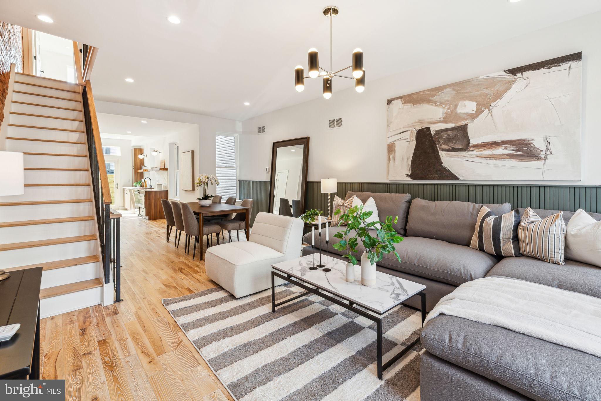 Introducing 1314 N. 27th Street! This remarkable renovation impresses immediately with exposed brick wall, hardwood floors, and elevated finishes. Enter to an open main level immersed with natural light with large front windows and a numbered transom. Wood accented railings echo the hardwood floors. Exposed brick and accented opposite wall travel through the living and dining area to a main level bathroom and galley kitchen. Open shelving compliments the ample cabinet storage space. Upgraded stainless appliances and quartz countertops. Sliding rear patio door extends the main level outdoors with oversized rear yard and mulched area representing the perfect outdoor flex space -- perfect for dogs or future plantings. Floating stairs lead to the second level and exposed, antique brickwork follows you there. Oversized window in the rear bedroom at a western exposure captures the evening sun. Customized closet shelving in each of the three bedrooms on this level. The back, two bedrooms are bifurcated by a full bathroom with shower/tub. Impressive primary bedroom suite with ample space for a king sized bed. Another custom closet. Don't miss the additional storage area above as well. Downstairs a finished basement with exposed beams to make the ceiling feel even higher. Plenty of rear storage in the rear mechanical and laundry room. On the same block as a coffee shop, community garden, and 5.5 acre park. Convenient to Center City Philadelphia, Fairmount Park, and I-76. Visit an open house this weekend or schedule your private showing today!