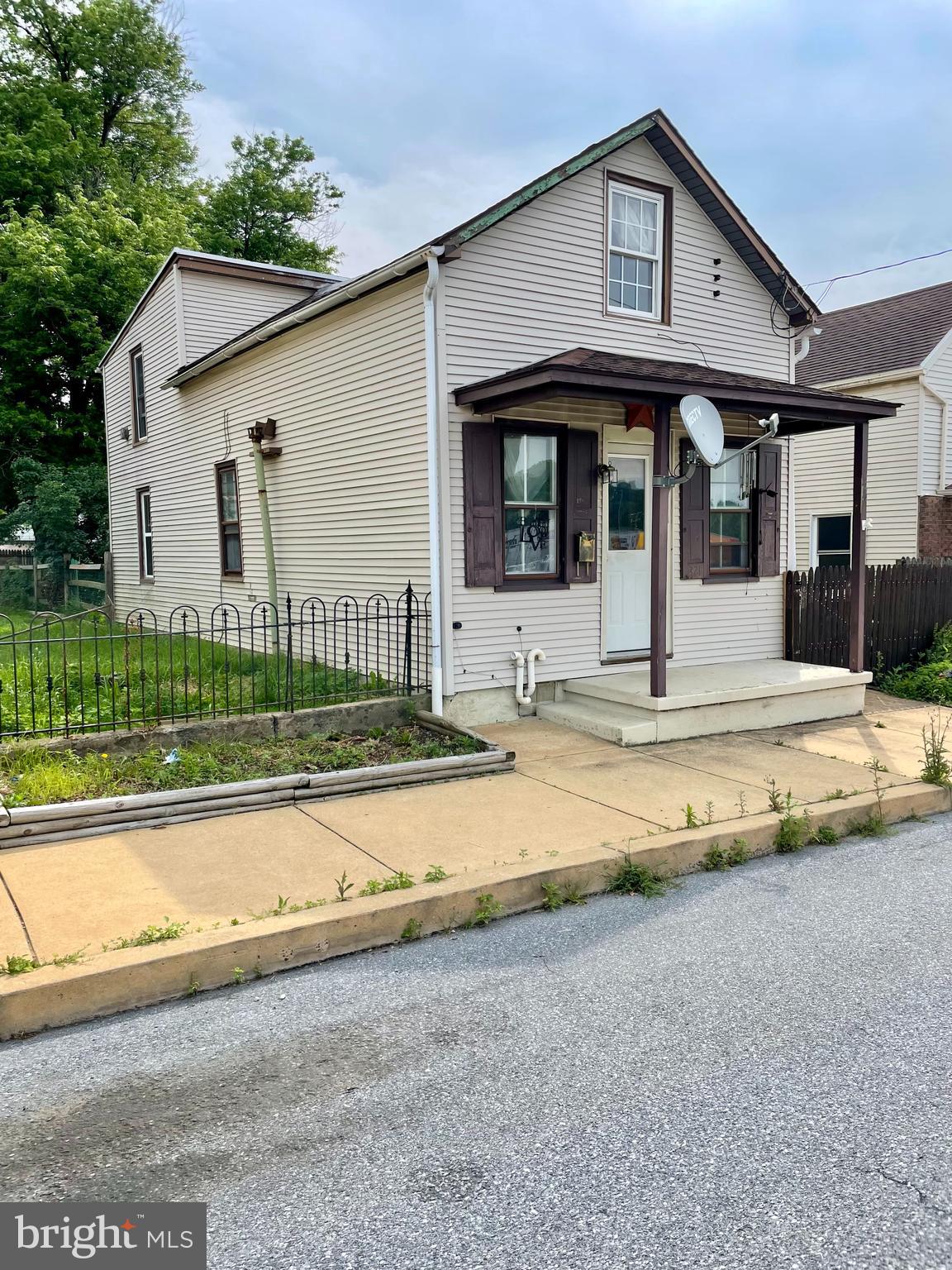 This inviting home offers comfort and potential, featuring recent updates including a newer roof, heating system, hot water heater, electric, and replacement windows in the kitchen and second floor. The deep backyard, which backs to an alley, presents a great opportunity to add a garage or create your own private outdoor retreat. It is within walking distance to the charming town of Manheim. With a little vision, this home could be transformed into something truly special. Come see the possibilities!