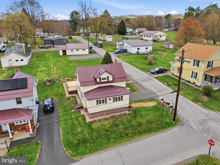A Bright New Beginning in the Heart of Curwensville. Perfectly positioned on a .21 acre corner lot, this inviting home blends comfort, updates & small town warmth — the kind of place that feels ready to welcome its next owner home.  Step inside to a freshly painted interior and luxury vinyl plank flooring throughout the main level. A handy mudroom leads seamlessly into the beautiful brand new kitchen, featuring knotty alder cabinetry, granite countertops, subway tile backsplash, a deep double sink with a gooseneck faucet & included stainless steel appliances.  A cheerful dining area, a spacious living room & a full bathroom with a walk in shower with a convenient laundry area with an included stackable washer & dryer complete the main floor.  Upstairs, you’ll find three nicely sized bedrooms, all with new carpet, along with a newly updated full bathroom featuring a tub/shower combo.  The unfinished basement provides ample storage and even includes a second laundry area with an additional washer & dryer talk about convenience.  Outside, enjoy your generous new deck, perfect for summer cookouts & quiet evenings. The peaceful backyard pairs beautifully with the oversized detached 2 car garage equipped with water & electric, plus plenty of off street parking. A polished, practical & welcoming Curwensville find ready for its next chapter.