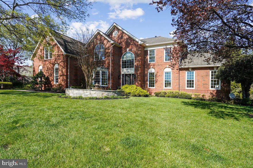 OVER $650K in UPDATES! Set on a private .60-acre cul-de-sac lot in the sought-after Hunter Mill Estates, this stunning colonial delivers over 5,800 square feet of thoughtfully refined living. A custom stone walkway and lush landscaping create an elegant first impression, while the extensively landscaped rear yard features a beautifully designed patio, open lawn space, and mature trees beyond, all complemented by in-ground irrigation and landscape lighting.
Inside, a welcoming open floor plan flows effortlessly from room to room, anchored by newly refinished hardwood floors and dual staircases with custom wrought iron spindles. The main level balances elegant entertaining and everyday comfort with a private office, formal living and dining rooms, a sunroom retreat, and a dramatic two-story family room where a soaring wall of windows floods the space with natural light, centered on a stunning marble fireplace.
The renovated gourmet kitchen is impeccably appointed with a Sub-Zero refrigerator, double ovens, a dedicated beverage and wine refrigerator, rich granite countertops, and custom soft-close cabinetry. A bright and airy skylit breakfast room flows naturally onto the screened-in porch with updated Trex decking and generous deck space, overlooking the tranquil stone waterfall, expansive patio, and beautifully landscaped backyard for a seamless indoor-outdoor connection.
On the upper level, rich hardwood floors continue throughout. The primary suite is a true sanctuary, offering spacious walk-in closets with custom organizers and a fully renovated spa bath with soaking tub, dual vanities, and elevated finishes. Every additional bedroom is ensuite, with built-in closet organizers and blackout blinds for comfort and privacy.
The walk-out lower level is designed for both entertaining and flexible living with a spacious recreation room, full custom bar, a versatile bonus room ideal as a second office or home gym, private fifth bedroom, and a luxurious fourth bath with steam shower and built-in sauna. A second half bath and direct patio access complete this exceptional level, where cascading stone waterfalls and lush landscaping create an outdoor escape.
Meticulously maintained and extensively updated, this home offers newer plumbing and lighting fixtures, fresh whole-house paint, elegant moldings, updated major systems including dual HVAC systems, water heater, garage doors, a refinished driveway, and new front-facing windows, making this a truly turnkey opportunity.
Conveniently located near the W&OD Trail, Hunter Mill Swim & Racquet Club, Silver Line Metro, and Dulles Toll Road, this exceptional home offers an elevated lifestyle in one of Vienna's most desirable neighborhoods.