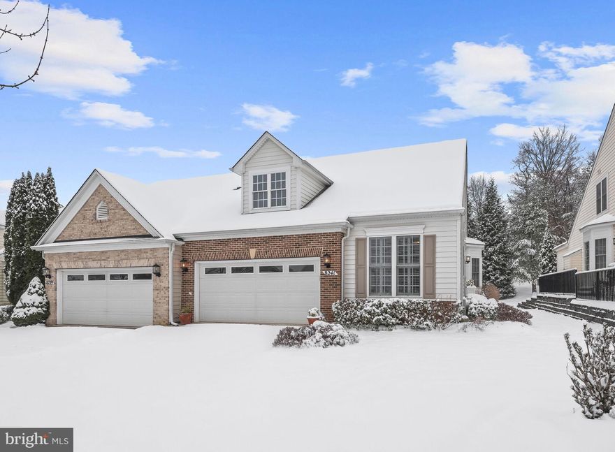 Gorgeous end-of-group townhouse awaits in the vibrant 55+ community of Hearthstone at Village Crest. 
This gem provides an abundance of natural light with its many windows and 9-foot ceilings. Take advantage of the community's amenities, including indoor and outdoor pools, tennis courts, a clubhouse, gym, and events room. The spacious floor plan unfolds with a grand 2-story foyer adorned with hardwood flooring, crown molding and wainscoting. The kitchen is a culinary delight with plantation shutters, granite counters, a tile backsplash, stainless steel appliances, a pantry, and a charming breakfast table space. The dining room, situated just off the foyer, exudes warmth and invites you to savor delightful meals in a sophisticated ambiance with a bay window. Adjacent to the dining room, a spacious living room awaits, adorned with a cozy gas fireplace that serves as the focal point of this inviting space.  On the main level, a primary bedroom beckons with an en-suite bath boasting a double vanity, soaking tub, separate shower with bench, and a walk-in closet. Revel in the luxury of a 2-car garage and the serenity of a sunroom addition featuring a cathedral ceiling and an atrium door leading to the composite deck. Enjoy the convenience of a main level den/home office, main level laundry, and central vacuum. Venture upstairs to discover a loft and two additional bedrooms sharing an attached full bath. The unfinished lower level offers ample space for storage, recreation, and the potential to transform into a finished space with an additional bedroom. This residence is the epitome of comfort and elegance, blending modern features with the tranquility of a 55+ community lifestyle.