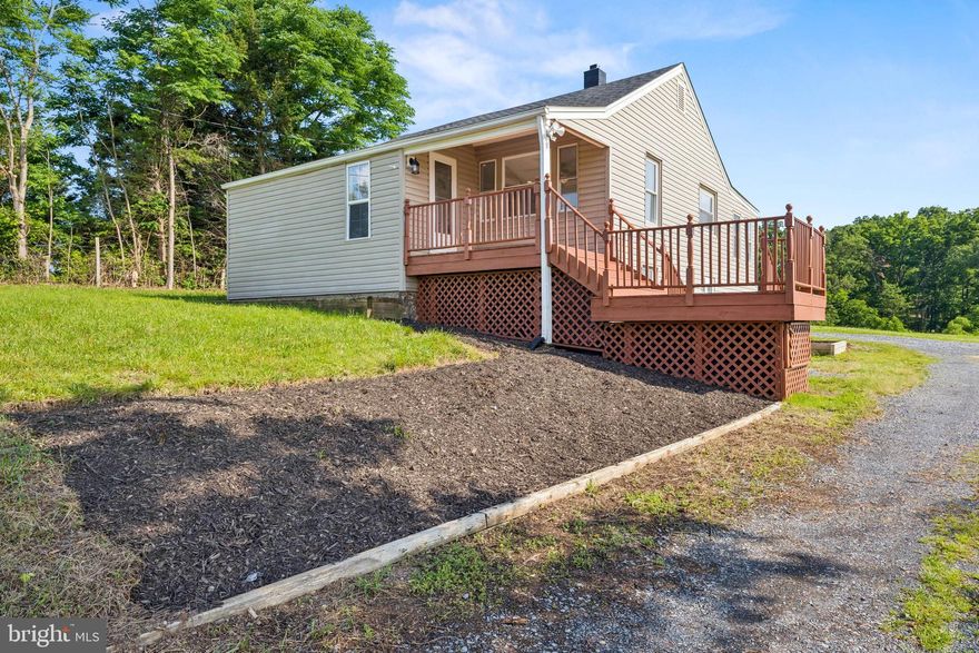 Welcome to this beautifully updated single-family home, perfectly nestled on a picturesque 2+ acre lot just minutes from Lake Frederick. Offering the ideal balance between tranquil country living and convenient access to major highways, shopping centers, and everyday amenities, this property delivers both serenity and accessibility. Surrounded by scenic views and peaceful open space, it’s a perfect retreat from the hustle and bustle of city life.

The home has been thoughtfully renovated with a number of quality upgrades, including brand-new luxury vinyl plank flooring, plush carpeting, fresh interior paint, updated lighting fixtures, a fully remodeled kitchen, and a modernized bathroom. As you step inside, you're welcomed by the warm and inviting main level, where sunlight pours through the windows and highlights the beautiful new flooring that runs throughout.

This level features two spacious bedrooms and a fully updated bathroom, showcasing elegant porcelain tile, a custom vanity, and designer finishes. The kitchen has been completely transformed with all-new cabinetry, stunning quartz countertops, a stylish backsplash, and stainless steel appliances—perfect for preparing meals and entertaining guests. The main level also includes a comfortable living room and a charming sunroom that offers serene views of the expansive yard.

The lower level expands your living space with a cozy second family room, an additional bedroom, and a dedicated laundry room with extra storage space—ideal for hobbies, organization, or potential future customization.

Step outside to enjoy the beauty of nature with plenty of room to roam, relax, or entertain. The property features multiple sheds for storage or workshop use and a patio area perfect for outdoor dining, bonfires, or gatherings with friends and family.

This move-in ready home offers a rare combination of modern comfort, privacy, and proximity to everything you need. Whether you’re seeking a weekend getaway, a peaceful full-time residence, or a place to grow and create lasting memories, this home is a must-see.