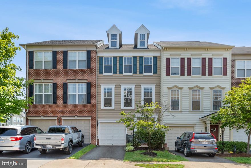 Welcome to Pemrooke of Victory Lakes! This spacious townhouse has nearly 2,200 square feet of finished living space. This house has a garage and driveway. Entry level has a large family/rec room with a fireplace and built-in shelving, along with a half bath, closet, and additional storage space.  Main level has a living room, kitchen, and dining room which opens to a large backyard deck that overlooks the common area. No neighbors directly behind you! Upstairs, you will find a generous master bedroom with a walk-in closet and master bath appointed with standing shower, soaking tub, and double vanity. Along with two additional bedrooms and a hallway bath, the washer and dryer are conveniently located on this bedroom level.  Upgrades in July 2023 include refinished kitchen cabinets, quartz countertops, new large stainless steel sink, new kitchen faucet, new luxury vinyl plank flooring throughout the entire house, new paint throughout, re-stained deck, freshly painted front door and shutters, and a new stainless-steel dishwasher to be installed by July 29th. This house is move in ready.  Community has tons of amenities. Just minutes from shopping, retail, restaurants, and entertainment at Braemar Village Plaza, Bristow Center Shopping Center, Virginia Gateway Promenade, and 2 Silos.  This location is also great for commuters with easy access to Rt. 66, Rt. 234, Rt 29, Rt 28 and the commuter train - Virginia Railway Express (VRE). Schools listed on Zillow are incorrect. This neighborhood was rezoned in 2022 for Victory Elementary, Marsteller Middle, and Patriot High School (see screen print of Prince William County zoning in the photo section of this listing). Apply through Rent Spree. Contact listing agent for link.