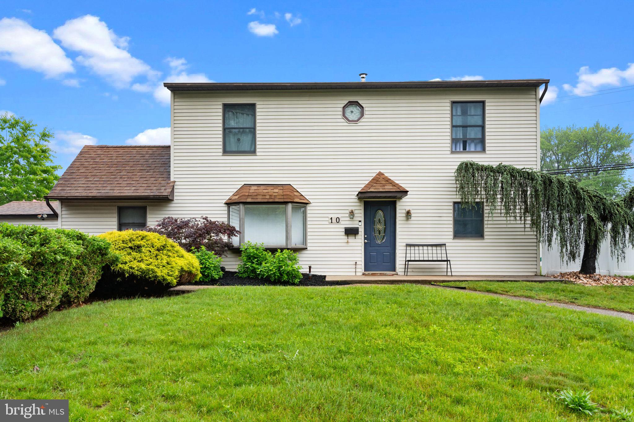Welcome to 10 Queen Lily Road, the home you’ve been waiting for in Levittown! Situated on a spacious corner lot within the highly sought-after Neshaminy School District, this expanded Jubilee model has been beautifully transformed into a two-story Colonial, offering true move-in readiness and exceptional living space. Step inside and be greeted by an expansive Great Room, where the Living Room seamlessly flows into the Dining Room/ Family Room, creating an open, versatile space perfect for both everyday living and entertaining. Gorgeous, low-maintenance flooring extends throughout this area, adding warmth and style. Sliding glass barn doors off of the family room lead to the perfect separate office space. The modern eat-in kitchen features beautiful tile flooring, neutral backsplash, open shelving, and newer high end appliances. The first floor offers a full bathroom with marble flooring and a spacious first-floor bedroom which adds to the home’s flexibility if one floor living is needed. Separate laundry room. Upstairs, the home continues to impress with a generous primary bedroom, highlighted by a bright skylight, private access to the newly remodeled primary full bathroom and large walk in closets. Two additional generous sized bedrooms, each featuring oversized closets and wall-mounted air conditioning, offer comfort and functionality. A tastefully updated hall bathroom with a newer vanity, tile flooring and linen closet completes the upper level. 6 Panel doors recently replaced throughout the 2nd floor. Attic space with pull down stairs in the upstairs hallway. Additional features include maintenance-free vinyl siding, Anderson windows throughout, two exterior storage sheds, and a spacious private fenced in backyard — perfect for pets, play or relaxation. Don’t miss your opportunity to make 10 Queen Lily Road your own. This home qualifies for a 1% Interest Rate Buydown for the first year at Zero cost to the buyer when using the preferred lender, or potentially $17,500 in grant funds that do not need to be paid back! Schedule your showing today!