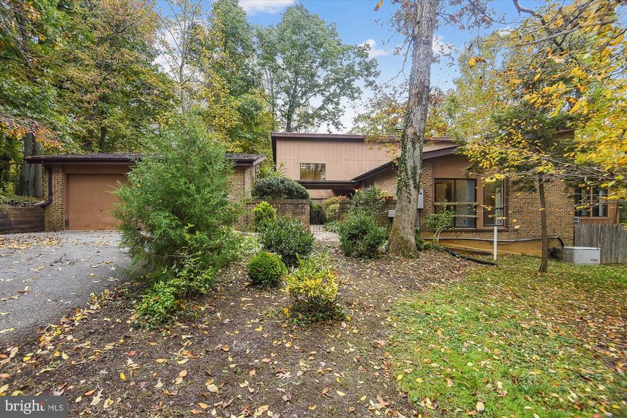 Significant Price Reduction!  Bring your best offer!  Wonderful large, modern style home for rent in Cabin John.  Enjoy the private, fenced courtyard when entering this spacious home featuring soaring ceilings, floor to ceiling windows and a large open space perfect for entertaining.  There is a Living Room with a dramatic brick wood-burning  fireplace leading to the inviting skylit Screened Porch.  The sizeable Dining Room opens to a convenient bright Sun Room with sky lights flowing to the Screened Porch.  The table space Kitchen has been updated with stone counters and stainless appliances.  The open staircase leads to the Lower Level with a big Family Room a second gas fireplace and sliding glass doors to the patio and yard.  There is a fifth Bedroom or Office, full Bath and Laundry Room/Storage Space.  The Lower Level with newly installed LVP flooring is perfect for an additional play or workspace.  The Upper Level features four Bedrooms including a generous Primary Bedroom with ensuite Bath and two separate vanities, three good-sized Bedrooms and a hall Bath.  Home Warranty.  The fenced backyard has a patio and  storage shed.  Talk about location!  Just off MacArthur Blvd with its walking/bike path leading to Glen Echo Park and the C&O Canal.  Short walk to the restaurants, shops, post office at MacArthur Plaza.  Convenient to commuter routes, I-495, Virginia, Clara Barton Parkway, GW Parkway, Ride-On Bus to Metro.  Apply On-Line with Rent Spree.