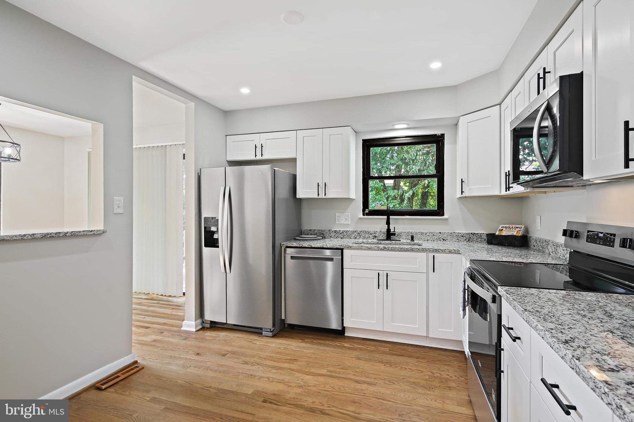 Tucked away on a peaceful no-thru street with minimal traffic, this beautifully updated 3 bdrm, 3 full bath contemporary split foyer offers privacy, space, and modern finishes—with no HOA! BRAND NEW: HVAC system, concrete driveway, concrete front walkway, and concrete stoop, patio, whole house freshly painted interior and exterior. Enjoy the outdoors with a large fenced yard and entertainment-sized deck!
Inside you’ll find a stunning ALL-NEW kitchen with soft-close white cabinets, granite countertops, granite breakfast bar, hardwood floors, & stainless steel appliances. Featuring two fireplaces, all new lighting, new flooring, new bathroom vanities, new toilets, new light fixtures. Walk-out basement includes a family room, laundry room with a large washer and dryer, and workshop/flex space. Conveniently located near major highways, shopping, and restaurants. Move-in ready and a true Catonsville gem!