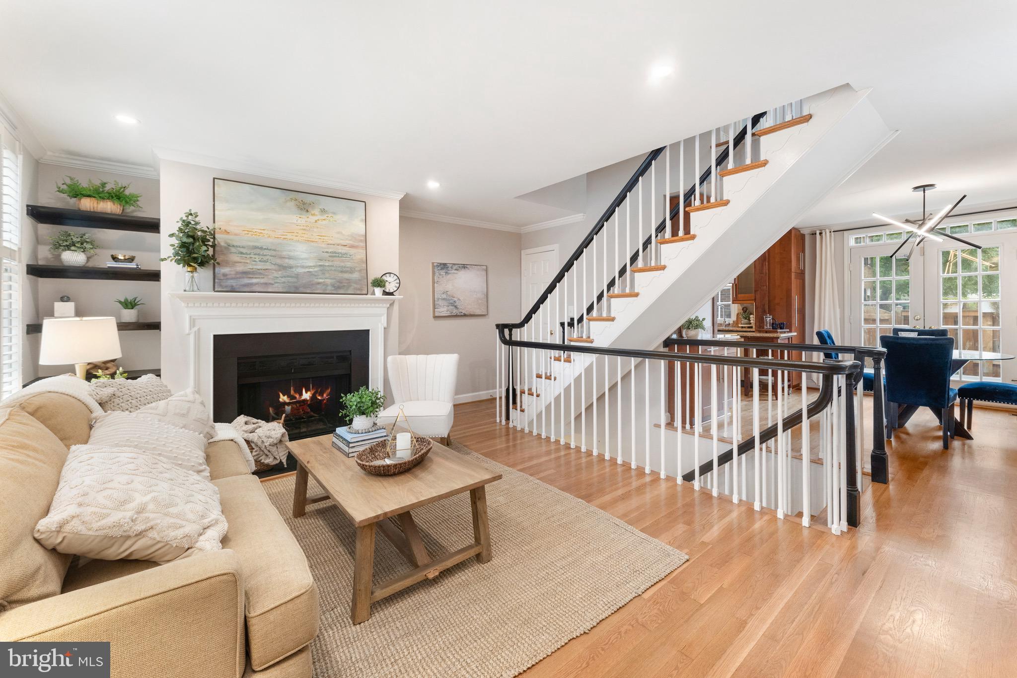 Set on a quiet street, this all-brick home combines modern living with classic Washington charm. Enjoy easy access to the Potomac River, the scenic GW Parkway and trails, and the vibrant dining, shopping, and boutiques of Old Town.
Inside, three finished levels with windows on three sides are filled with natural light. The kitchen boasts stainless steel appliances, granite countertops, generous cabinet space, and sleek contemporary finishes. Relax by one of two wood-burning fireplaces—located in the main living room and the lower-level family room.
The upper level offers two bedrooms, including a primary with dual closets, a second bedroom with a walk-in closet, and an updated full bath with a marble vanity. The versatile lower level doubles as a guest suite, second family room, or office complete with a full bath and laundry/storage area. Hardwood floors run throughout the main and upper levels with plush carpet below.
Entertain outdoors on the back deck with a privacy fence. The home is less than a mile to the Braddock Rd Metro station and less than 4 miles to Regan Airport – easy and quick commuting! There are also two deeded parking spaces located directly in front of the home!
This move-in ready home combines style, comfort, and unbeatable location. Welcome Home!