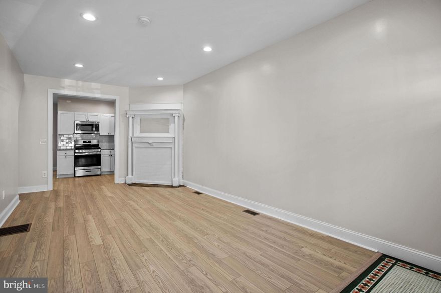 This one-bedroom apartment has just been completely renovated with brand new flooring, a modern kitchen, and a fully updated bathroom while keeping some of the historical charm throughout the space including the original fireplace, tile details and woodwork. The new windows let in plenty of natural light and showcase the beautiful finishes throughout the space. You'll enjoy cooking in your new kitchen with its sleek granite countertops, subway tile backsplash, and stainless steel appliances, including a dishwasher, gas range, and refrigerator. The apartment also features convenient amenities such as in-unit washer dryer, central heat and A/C, and smart locks. The shared porch area is the perfect spot to enjoy a cup of coffee or chat with your neighbors, while your private outdoor space provides a quiet space to relax after a long day.