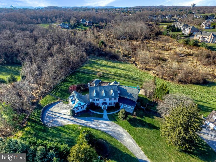 LOCATED IN ELITE STONEWALL OF 5 ESTATE HOMES-IDEAL COMBO OF NEW CONSTRUCTION OF THE MAIN HOME WITH BIG OPEN SPACES,HIGH CEILINGS,CUSTOM DETAILS,HW FLRS,GOURMET KIT,ENSUITE BEDRMS,LUX MASTER,AU-PAIR SUITE,&ATTACHED 1852 Cir STONE ADDITION INCLUDES AMAZING CHARM,OFFICE W STONE FP,STONE SUN RM,PRIVATE GUEST STE**OUTDOOR LVING WITH PAVILLION BBQ&KITCHEN,POOL,SPA,FIRE PIT OVERLOOKS YARD & CONSERVATION