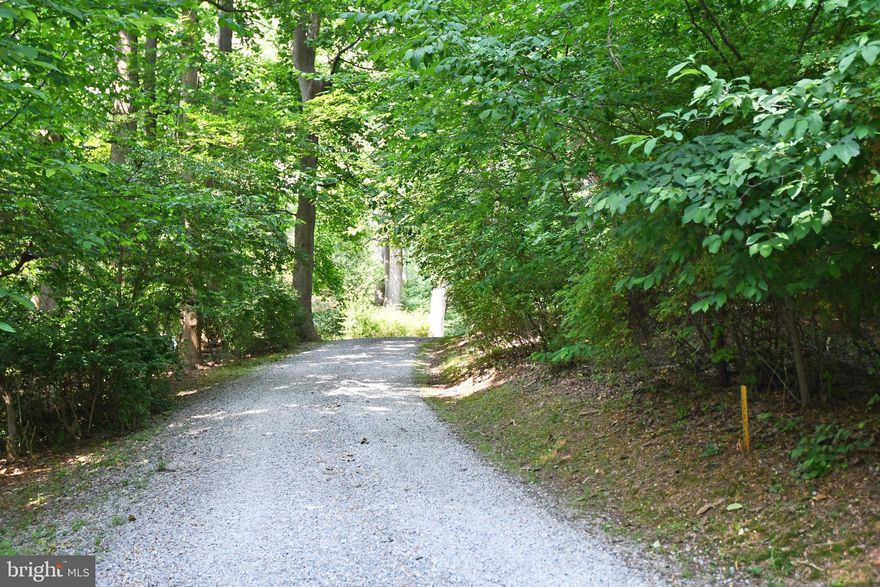 Beautiful wooded parcel located on a private road at the tip of Grove Point.  The neighborhood backs to the Girl Scout Camp providing a nice buffer against future development.  The beach access provides unlimited walking and recreation opportunities on the bay