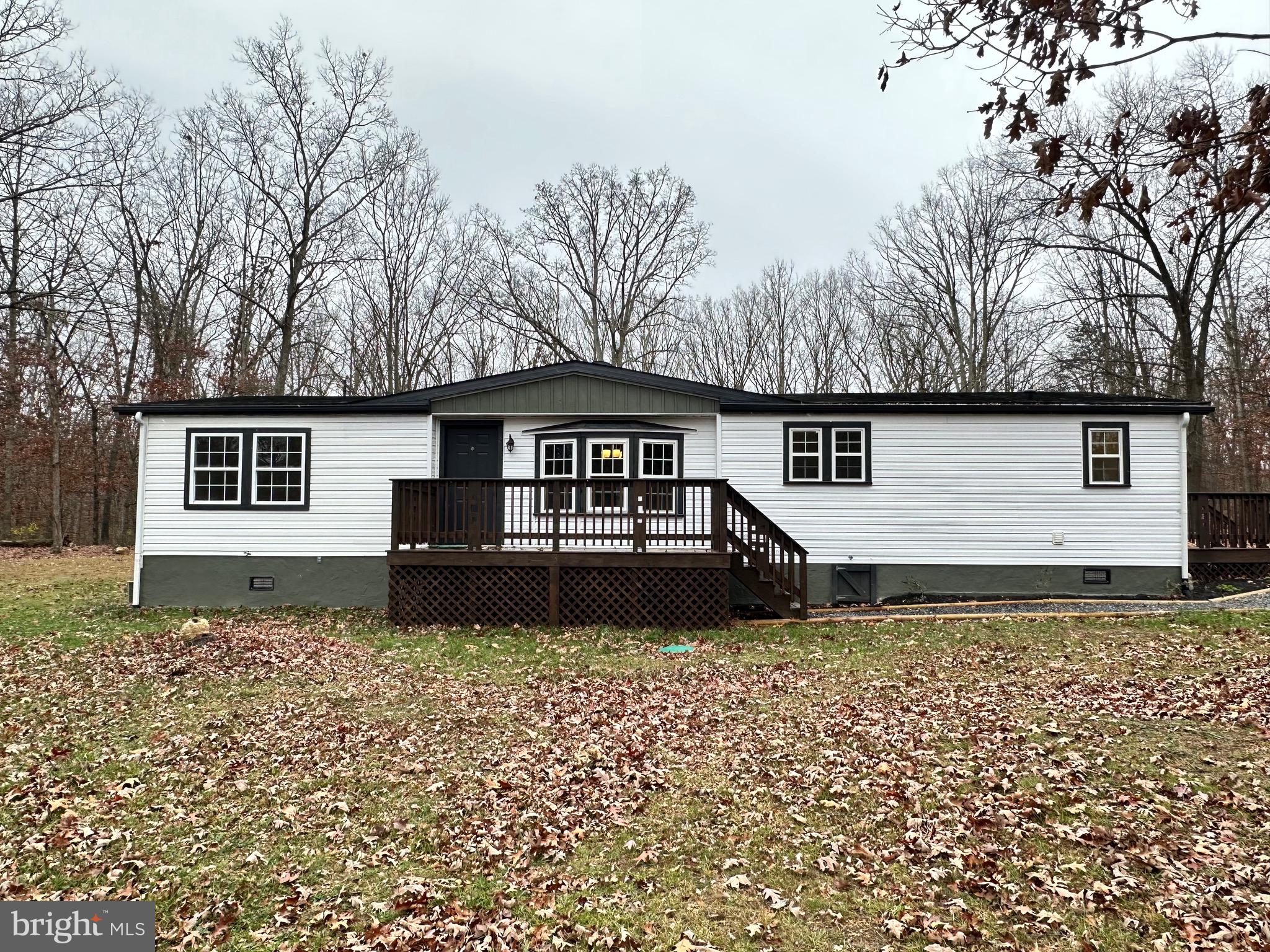 REMARKS: PETERSBURG – COMPLETELY REMODELED 3 BEDROOM, 2 BATH VINYL RANCHER SITUATED ON A PRIVATE 2 ACRE LOT IN OAK HAVEN FARM SUB-DIVISON. OPEN FLOOR PLAN WITH GRAND ARCH DOORWAYS. FULY EQUIPPED KITCHEN WITH BREAKFAST BAR, NEW APPLIANCES AND CERAMIC FLOORING. LARGE LIVING ROOM WITH CAROLINA STACKED STONE GAS FIREPLACE W MANTLE. HUGE 2-PART FAMILY ROOM FEATURING NEW LAMINATED HARDWOOD FLOORS AND FRENCH DOORS LEADING TO REAR ENTERTAINMENT DECK (OR JUST RELAXING ON THOSE LAZY DAYS). MASTER BEDROOM OFFERS UPSCALE PRIVATE BATH WITH JACUZZI TUB SURROUNDED BY CERAMIC TILE WALL & FLOOR. SEPARATE SPACIOUS LAUNDRY ROOM WITH CERAMIC TILE FLOORING, INCLUDES NEW HOT WATER HEATER AND DRYER. DETACHED 1-CAR GARAGE W NEW VINYL GARAGE DOOR AND WORKBENCH- REAR PICTURE WINDOW TO ENJOY THE WILDLIFE THAT COMES TO GATHER. LONG GRAVEL DRIVEWAY, ABUNDANT SHADE TREES AND PLENTY OF ROOM FOR OUTDOOR LIVING. CALL TO SCHEDULE A VIEWING, BUT HURRY… THIS ONE WILL GO FAST!!!!