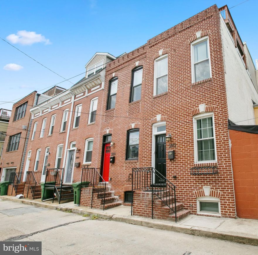 This spacious renovated home is in the perfect location in Canton, tucked away on a quiet street and close to local dining, nightlife, shopping and the beautiful parks and waterfront promenade.  This Charlene Doverspike designed home is a true stand out that offers thoughtful, elevated design and features throughout such as tray ceilings, a beautiful barrel ceiling, transoms that allow light to flow  into every room, and so much more. Open the door and fall in love. The well designed central kitchen has more cabinet & counter space than a typical Canton kitchen and features stainless steel, granite, a breakfast bar, and built in wine rack.  It opens to both the dining room and the living room- a unique open flow floor plan that is perfect for entertaining. The dining room is at the front of the house and the huge living area is just behind the kitchen.  Upstairs, there are 2 large bedrooms with great closet space and a large centrally located bathroom with separate custom shower, double bowl vanity, and a jetted soaking tub. There is central hall interior access to the rooftop deck that offers fantastic city & water views & a clear view of the iconic Mr. Boh. The finished lower level includes the 2nd full bathroom and another finished room which could be used as a 3rd bedroom, den, office, home gym, etc. This impeccable home has been well maintained & updated with fresh paint, carpet, and on trend lighting fixtures. The only thing missing is you!