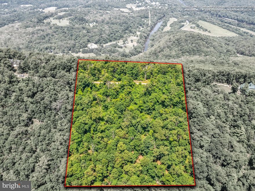 For those seeking privacy, security, and natural beauty, this 10 acre property within a gated community is an ideal choice.  Its hilltop position offers a potential panoramic view, complemented by the property's beautiful hardwood trees and natural stone.  Restrictions apply to protect the community's natural charm, and easy access makes this a perfect opportunity for a luxury home or investment.   NO AirB&B's or short term rentals allowed.