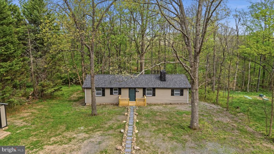 Nestled in the charming Shawneeland community, you will enjoy the mountain views in this delightful ranch-style home which offers a perfect blend of comfort and modern living. With a major renovation completed in 2026, this residence boasts a fresh and inviting atmosphere, ideal for creating lasting memories. The exterior features low-maintenance vinyl siding, complemented exterior lighting that enhances the home's curb appeal. A spacious deck invites you to enjoy serene evenings outdoors, while the expansive 0.56-acre lot provides ample space for gardening, play, or simply unwinding in nature. An outbuilding will offer additional storage solutions, making organization a breeze.

 Inside, the home features three cozy bedrooms and two full bathrooms, designed for both relaxation and functionality. The luxury vinyl plank flooring throughout adds a touch of elegance while ensuring durability. Gather around the electric fireplace in the living area, perfect for cozy nights in. Shawneeland is not just a place to live; it's a community that thrives on connection. The local schools are well-regarded, providing quality education and fostering a sense of community spirit. With convenient public services and a welcoming atmosphere, this neighborhood truly feels like home. Experience the warmth and comfort of this lovely property, where every detail has been thoughtfully considered for your enjoyment.

The Seller is offer a Home Warranty,  so you can buy with confidence.