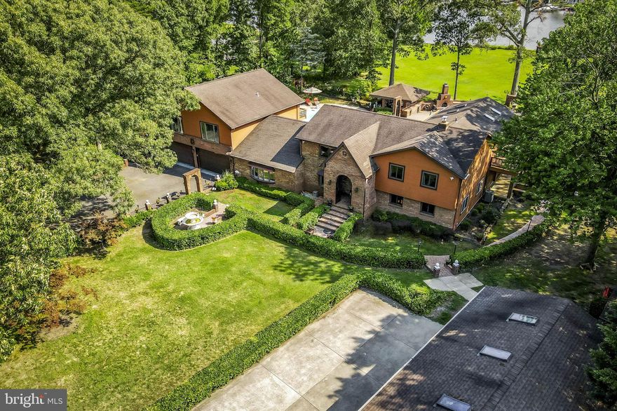 PRICE REDUCTION!!!!!!!!

Luxurious Waterfront Estate on the Bodkin Creek – Pasadena, MD

Step into unparalleled elegance with this magnificent waterfront estate, ideally located on the serene Bodkin Creek. This extraordinary property spans 2.37 acres and boasts over 300 feet of pristine river frontage, offering breathtaking views and exceptional amenities.

Key Features:

Expansive Living Quarters: The estate features 6 generously sized bedrooms and 5 bathrooms. The master suite is a true retreat, offering stunning creek views, a private balcony, and a spa-like en-suite bathroom with a soaking tub and walk-in shower.
Versatile Separate Apartment: This self-contained unit includes its own full kitchen, living area, and two large bedrooms, providing the perfect solution for multi-generational living, guest accommodation, or potential rental income.
Resort-Style Amenities: The property boasts a swimming pool with a sun deck, a relaxing sauna for unwinding after a long day, and a fully-equipped gym to maintain your fitness routine in privacy and comfort.
Exceptional Outdoor Living: The sprawling brick patio is ideal for entertaining, featuring ample space for dining and lounging while enjoying the picturesque river views. The gazebo, complete with an outdoor fireplace, offers a cozy setting for evening gatherings or quiet moments by the water.
Private Sandy Beach & Deep Water Pier: Enjoy your own sandy beach for sunbathing and water activities, as well as a deep water pier, perfect for docking boats and indulging in waterfront recreation.
Extensive Parking & Storage: The estate includes a 5-car detached garage and a 2-car attached garage, providing abundant space for vehicles, boats, and additional storage needs.
Picturesque Setting: Floor-to-ceiling windows throughout the home maximize natural light and showcase the spectacular creek views, seamlessly blending indoor and outdoor living spaces.
Additional Features: The property is meticulously maintained and includes
modern appliances and energy-efficient systems, ensuring a luxurious and comfortable lifestyle.
This rare estate offers a unique combination of luxury, privacy, and natural beauty. Don’t miss the opportunity to own this unparalleled property. Contact us today to schedule your private tour and experience the extraordinary lifestyle this home has to offer. Home does not require flood insurance