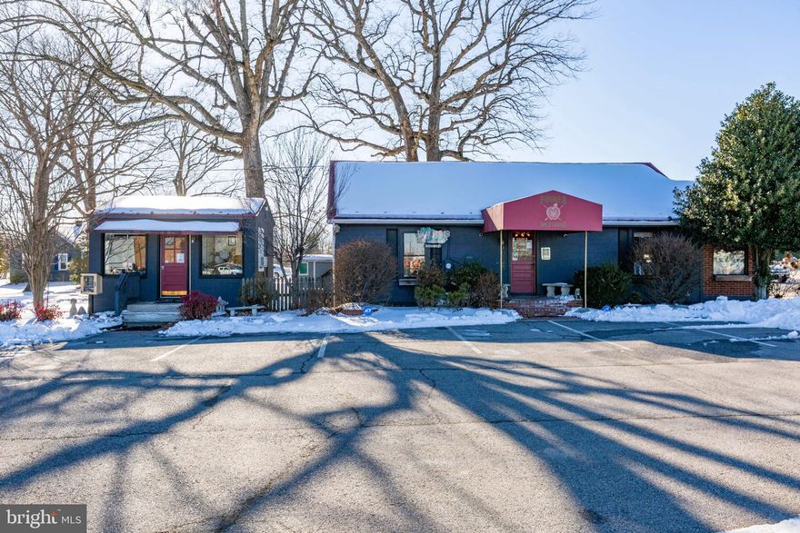 Versatile, upgraded commercial property positioned at the signalized
hard corner of Courthouse Road (Route 208) and Hood Drive in
Spotsylvania County. This two-building offering combines strong
exposure, natural light, and flexible layouts making it ideal for retail,
office, medical, studio, or professional service users.
The main Building underwent a thorough renovation in 2020 with a
new HVAC system installed in 2022. The primary structure features
three open and versatile rooms, a welcoming reception area, kitchen,
and restroom. Currently operating as a tattoo and art studio, the
space easily adapts to boutique retail, salon, wellness, counseling,
design, or general office use. Large front display windows and
additional windows throughout create an inviting, light-filled
environment while maximizing street visibility. 
A second detached studio offers a private, single-room layout with its
own bath—perfect for an executive office, treatment room, studio, or
rental suite. Oversized windows enhance visibility and create a bright,
professional setting. If you need more space, Seller has plans for
construction of another Building on site.  
Situated along a primary commuter corridor with convenient access
to I-95 and Route 1, the property benefits from steady daily traffic and
proximity to dense residential areas, neighborhood retail, and the
Fredericksburg VA Health Care Center.