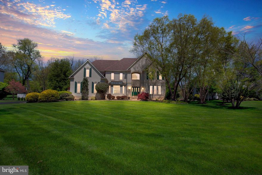 Welcome to 1371 Taylor Drive, a marvel of luxury living nestled along Core Creek Park in Langhorne. This magnificent Gigliotti, oversized, custom-built home, crafted in 1995 with steel-beam construction, stands as a testament to exquisite design and meticulous attention to detail.

As you approach home in this sought-after community, you'll be greeted by a meticulously landscaped exterior, adorned with a diverse array of trees including ash, white pine, cherry, dogwood, birch, blue spruce and Japanese maple. The recently refreshed window trim and flat stucco banding exude curb appeal, along with a newer 140-foot driveway. Out back, you'll enjoy the freshly maintained 500-square-foot deck, complete with a charming gazebo, ideal for savoring tranquil moments amidst the serene surroundings.

Venture inside, and you'll be captivated by the grandeur that awaits. The two-story foyer boasts marble flooring, complemented by finished-in-place oak hardwoods, setting a tone of refined elegance. In the living room, crown molding and custom woodwork frame expansive 60-inch windows, inviting natural light to dance across the space. In the dining room, a tray ceiling, chandelier and customized cantilevered window bump-out provide a unique feel. A bonus room next to the powder room provides flex space — the current owners use this as one of two offices.

Next, indulge in the delights of the "over-budget" kitchen, where no detail has been spared. A recent renovation showcases porcelain tile floors, granite countertops, and top-of-the-line Viking gas appliances, including a double oven. Custom furniture-grade cabinetry and built-in organizers (there are even hidden spots for handbags and for the mail) offer both functionality and sophistication, while the 50-bottle built-in wine fridge adds a touch of opulence.

The crème de la crème here might be the showstopping great room, with 18-foot ceilings and 16-foot windows providing views of Core Creek Park and an indoor/outdoor living experience. A custom 2-story stone gas fireplace and mantle, along with a large pass-through to the eat-in area of the kitchen provide beauty and practicality. 

Upstairs, find four generous bedrooms, a full hall bath with ceramic tile, and a Juliet balcony overlooking the great room. Here, you can retreat to the sanctuary of the owner's suite. Double granite-counter vanities, a jetted Jacuzzi tub, and a travertine rain shower create a spa-like oasis within the ceramic-tile bath. Dual walk-in closets, a sitting room, and double-crown molding further elevate the experience, ensuring unparalleled comfort and style. A second office here is a big plus too.  

Entertainment abounds in the expansive basement, featuring a tray ceiling, custom lighting, and space designed especially for the pool table. Italianate columns add a touch of refinement, while a flex room with vinyl plank flooring beckons as a potential dance studio or a fifth bedroom. With more than three rooms — including another living room and a bar — and ample storage, this lower level offers endless possibilities for customization and enjoyment.

For added comfort and convenience, the upstairs has a separate electric HVAC system. Downstairs is on a newer heat pump with gas backup and a HEPA filter, ensuring optimal air quality year-round. With its superior insulation and energy-efficient design, this residence boasts lower utility bills compared to its neighbors.

Experience unparalleled living at 1371 Taylor Drive — a home where every detail has been thoughtfully curated. Don't miss your chance to call this exquisite estate your own.