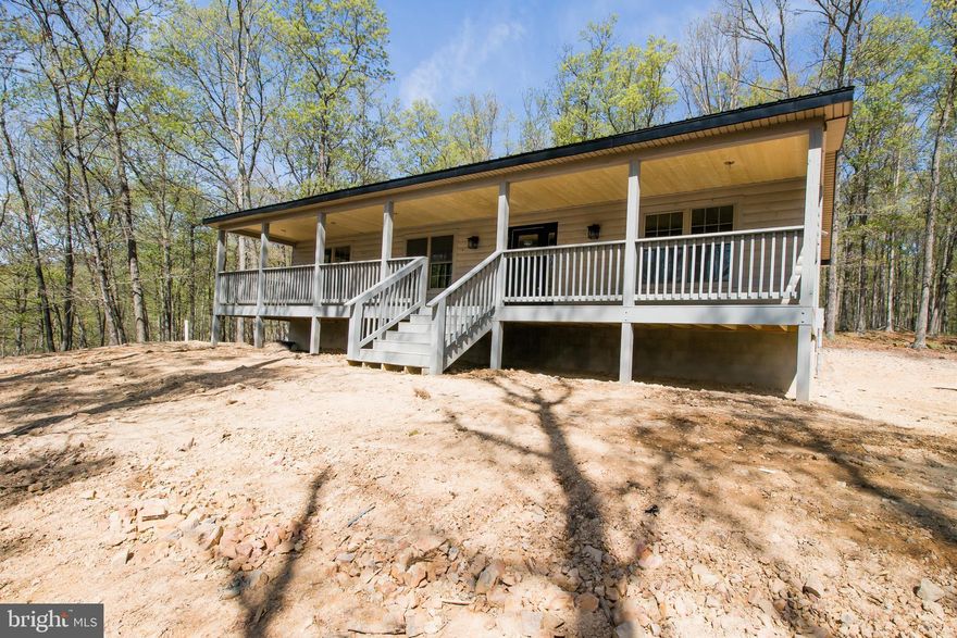 Lost River WV Cabin on 8 Acres!!  Minutes from Lost River State Park, Trout Pond Rec Area & Kimsey Lake which is stocked year round. Newly Constructed 1,500 Square Foot Log Home, With 3 Bedrooms and 2 Full Baths.  Completely Open Floor Plan Featuring an Expansive Great Room w Vaulted Ceiling & a  Large Kitchen with Quartz Counters, SS Appliances and an Island Great for a Quick Meal on the Go.  Quality Craftsmanship from Top to Bottom-Solid Pine Paneled Doors Throughout, Tongue and Groove Natural Pine Walls, 20 mil LVT Flooring, Over 60 Can Lights and more. Exterior is Natural Log Siding, with a Black Metal Roof, and also Features an Amazing Front Porch to Enjoy the Seasonal View, or Just Sit and Listen to it Rain on a Warm Summer Evening.