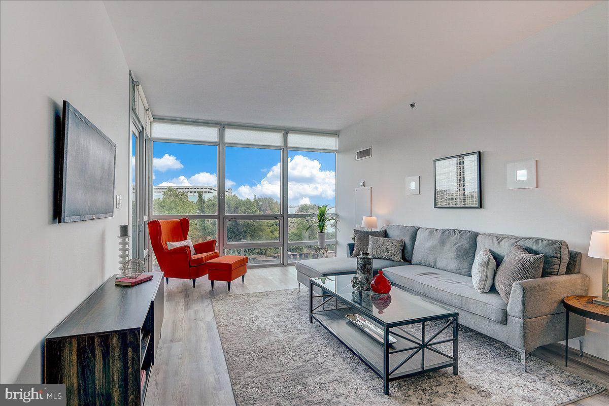 Photos represent the same unit, styled with different décor. Experience the pinnacle of riverfront living in the community’s most sought-after floor plan, fully renovated to perfection. From the moment you arrive, you are welcomed into an expansive open-concept living and dining space, where a dramatic wall of floor-to-ceiling windows frames ever-changing views of lush green space and the Delaware River. At the heart of the home, the newly renovated chef’s kitchen dazzles with modern upgrades and a seamless flow into the living area, ideal for both everyday living and entertaining.
Step onto your private balcony, covered with a sleek water-resistant covering accessible from both the living room and a bedroom. Here, morning light and serene views set the perfect backdrop for quiet moments or gatherings with friends. The owner’s suite is a private retreat, featuring a custom wall of built-in cabinetry that seamlessly combines elegance and functionality, along with a beautifully renovated ensuite bathroom. Every detail has been thoughtfully considered, from stylish finishes throughout to the flexibility of converting the spacious powder room into a full bath (with management approval).
This home offers the rare convenience of covered garage parking with direct, same-level access.
At the prestigious gated Waterfront Square Condominium & Spa, residents enjoy an array of unparalleled resort-style amenities:
✔ 24/7 gated security & concierge service
✔ State-of-the-art fitness center, steam room, sauna & massage rooms
✔ Expansive sundeck with indoor junior Olympic-size heated pool & hot tub
✔ Two fenced dog parks & play area
✔ Additional storage available for rent or purchase
✔ Three-level garage with EV charging stations
✔ Philadelphia’s largest green roof with manicured landscaping
✔ On-site management & advanced security systems
✔ Complimentary weekday shuttle to 30th Street Station with stops along Market Street and the Benjamin Franklin Parkway
Set within a private 9.5-acre riverfront enclave, this serene retreat offers effortless access to major highways, bridges, and Philadelphia International Airport, while the dining, shopping, arts, and culture of Center City are just minutes away.
If you seek iconic views, resort-style amenities, and an unparalleled lifestyle, welcome home to Waterfront Square.