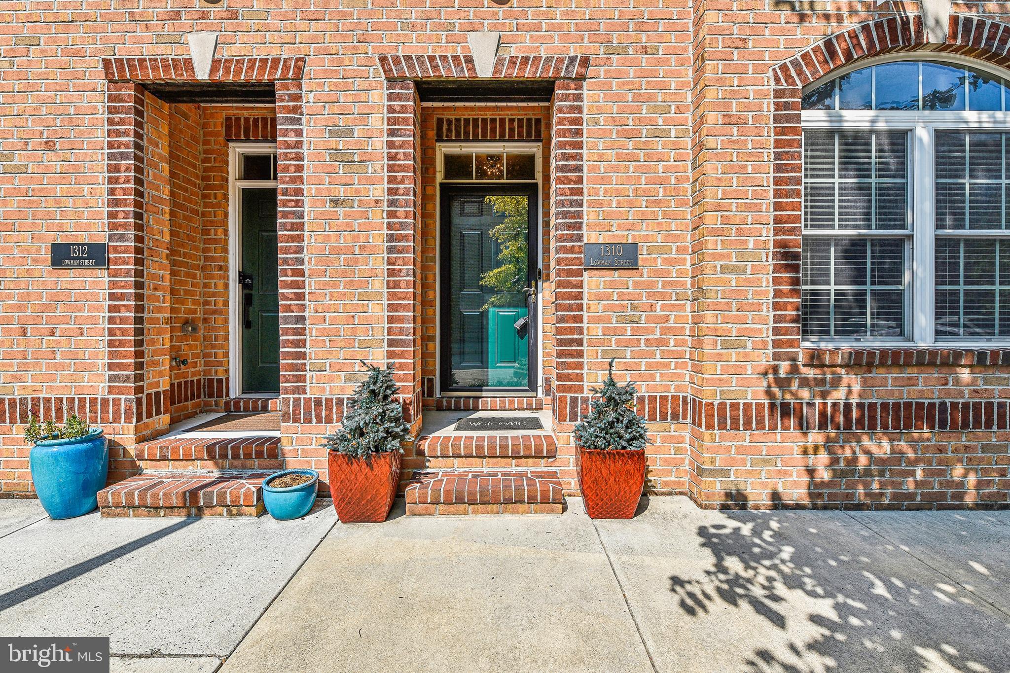 Welcome to 1310 Lowman St. This 4 bed, 3.5 bath modern townhome stunner is loaded with amenities. Located in the sought after community of Locust Point, tucked behind McHenry Row. Convenience to fantastic local shops, restaurants, stadiums, gyms, and I95 has made this one of the premier neighborhoods the city has to offer. The main level features a beautiful kitchen with granite countertops, upgraded cabinets, stainless steel appliances, brick backsplash, large kitchen island as well as a half-bath off of the kitchen. The open concept layout flows from spacious living / family room with gas fireplace, into a dining area that holds a Butler’s Pantry with undercounter wine fridge and mini-fridge, making this the perfect area for entertaining family and friends. Off of the kitchen sits a large deck with a spectacular view, as well as a built-in gas line that provides an easy hook up for your grill. The deck also holds outdoor speakers which are connected to a music system that runs through both decks, main level, and the primary bedroom. The upper- level features a large primary bedroom with full bath, and 2 large walk-in closets with built in organizational systems. The upper level is rounded out by another full bath, 2 more bedrooms, and a staircase that leads to wet-bar so you can make yourself a nice cocktail before you head out onto the spectacular rooftop deck. The lower-level houses another full bath and a 4th bedroom, which can also be used as an office, den, or home gym. The back parking-pad leads to a 2-car garage with overhead and built-in storge systems, key pad remote, and an in-house Tesla charging station. This beautiful home is fully loaded with incredible features, and WILL NOT last long. Book your showing today!