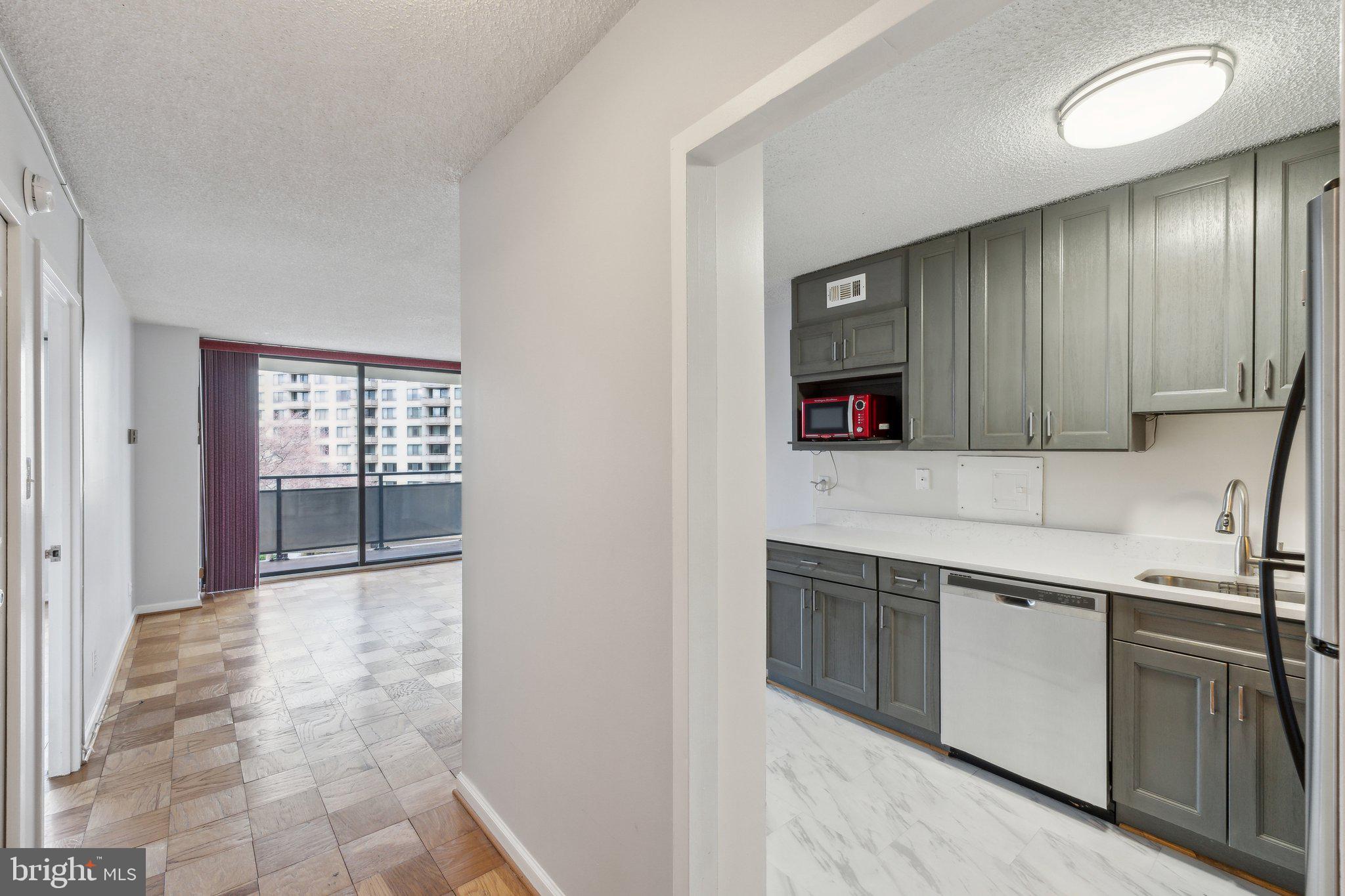 Welcome to this beautifully renovated one-bedroom with balcony apartment in the prestigious Promenade Towers. The coop fee can be reduced by up to $692 annually, after applying for the Homestead Exemption. The oversized windows look out towards the elegant entrance to the building from the fourth floor, and to the delightful park in front of the entrance. The kitchen opens to the living room. In the kitchen, there are stainless appliances, to the ceiling cabinets, quartz counters, countertop lights and a new ceiling light. The living room and bedroom have wooden floors. Off the living room is the delightful balcony. There is a beautifully updated bathroom with a tiled shower (bath), and a large sink cabinet with lots of storage and a new toilet. The bedroom hosts a large walk-in closet with built-ins. There is another large closet in the foyer. Garage parking is also included with the unit and it is near the exit of the G2 level, while a second car or friends can park in the visitor lot.
The building has many activities and amenities and provides a resort like experience. The recently redecorated Arcade level has a state-of-the-art fitness center with an indoor pool and hot tub: locker rooms with showers and sauna. Also in the Arcade is Chef Tony's restaurant (a well-known seafood/Italian eatery), a grocery store/deli, dry cleaners, travel agent, beauty salon, resident lounge, party and conference rooms. There is a large outdoor pool with adjacent grills. Tennis (lighted courts) and pickleball have their own building as you drive onto the property. Ping pong is played regularly, as are social activities such as "Breakfast at Wimbledon". There are too many activities to mention them all. A few are ...trivia night, open mike night, monthly fun movies, lectures, vaccinations, vote in all elections in the party room (including Presidential). There is meditation, exercise class, book club, canasta, bridge, and mahjong. There are wine and cheese get togethers in the lobby, a rocking New Year's Eve party and various other celebrations.
The property also includes car charging stations, and a car washing area with a dynamite vacuum. It is also easy to get to the Red Line Medical Center metro stop at NIH/ Walter Reed as a bus comes to the front door of the Promenade every 40 minutes during the week. The location is close to 495 and 270 and the Wildwood Shopping Center which has Balduccis, CVS, Bethesda Bagels, Starbucks, several places to eat and several cute boutiques. A 24-hour Giant foods grocery store is also about a 5 minute drive away.