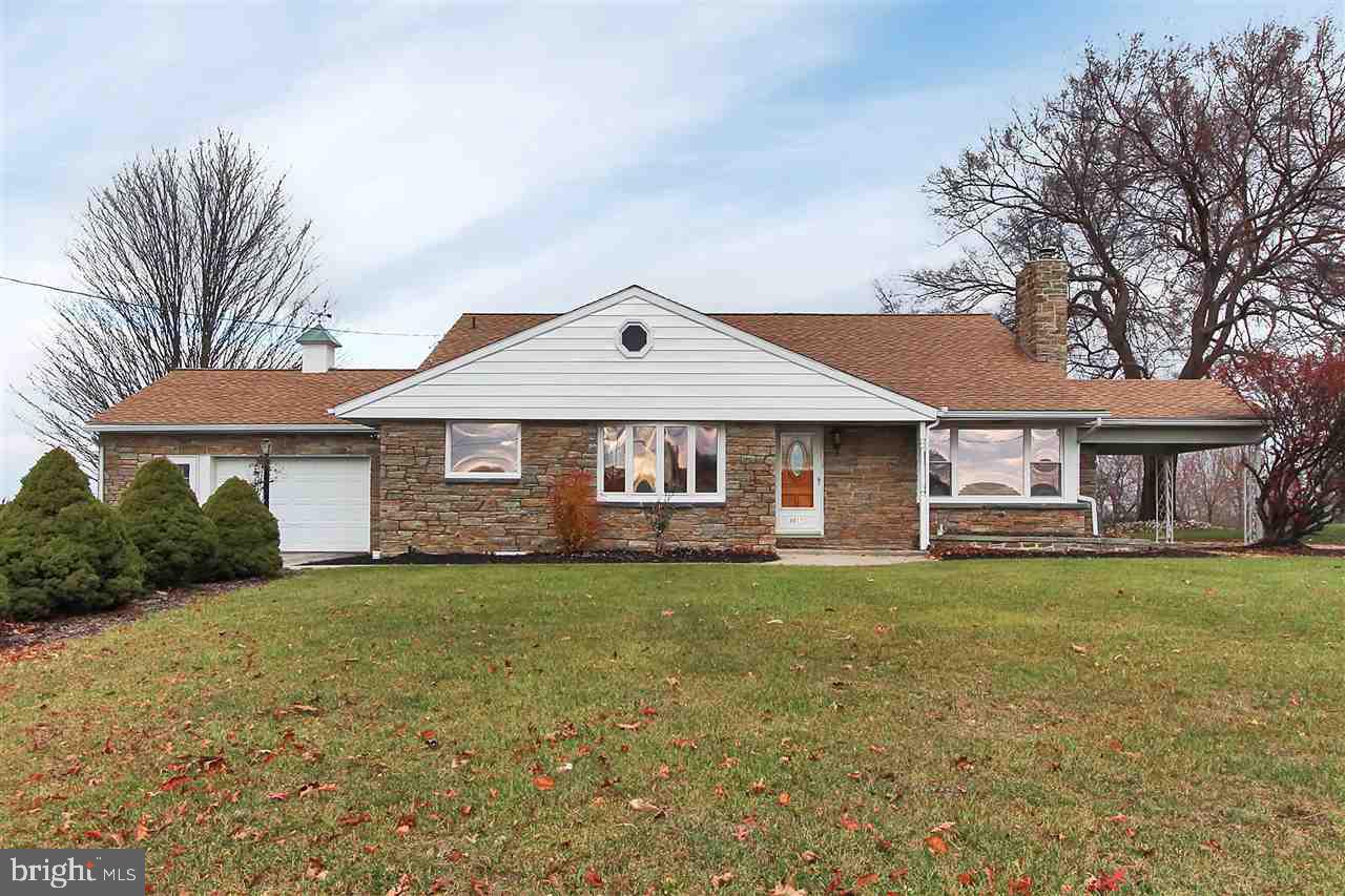 Beautifully updated stone home on 6+ acres with breath taking views. Hardwood floors throughout. New kitchen with appliances. New water heater. Several out buildings and garages including a pavilion and stone patio. Close to MD line. AC 1 year young. Attached 2 car garage with AC.