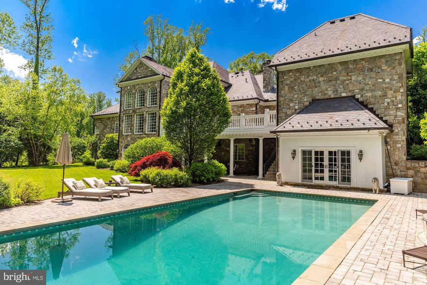 A rare complete "close in" McLean Estate built by Luxury home builder, George Sagatov with the highest quality materials and workmanship, Sited on almost 3 private acres with a gated entrance, Pool & Spa, Pool House, Tennis Court, Batting Cage, Carriage House with separate Apartment and beautiful landscaping at every turn- this property is truly a sanctuary. A circular driveway brings you to the timeless stone exterior that has 3 attached and 2 detached garages. The sophisticated two story Foyer with curved staircase opens to the elegant Dining Room, cozy Living Room with fireplace, stunning cherry paneled Study, dream Kitchen with stone fireplace and custom cabinetry. A two-story Family Room with soaring windows has an eye-catching stone fireplace and French doors to the rear Deck. A gracious First Floor Guest Suite/second Owner’s Suite is complete with walk-in closets and spa Bath with separate vanities. The upper level has the luxurious Owner’s Suite with a separate Sitting Room and spa-like Bath. Three additional Bedrooms all with private Baths. One-of-a-kind Lower Level has a full Bar, Wine Cellar, Recreation Room, extraordinary home Theatre, massive stone fireplace, incredible Gym and more! Located on the most exclusive road in Mclean. Professionally decorated. Like living in a resort while close to Washington DC and Tysons Corner as well as both International Airports.