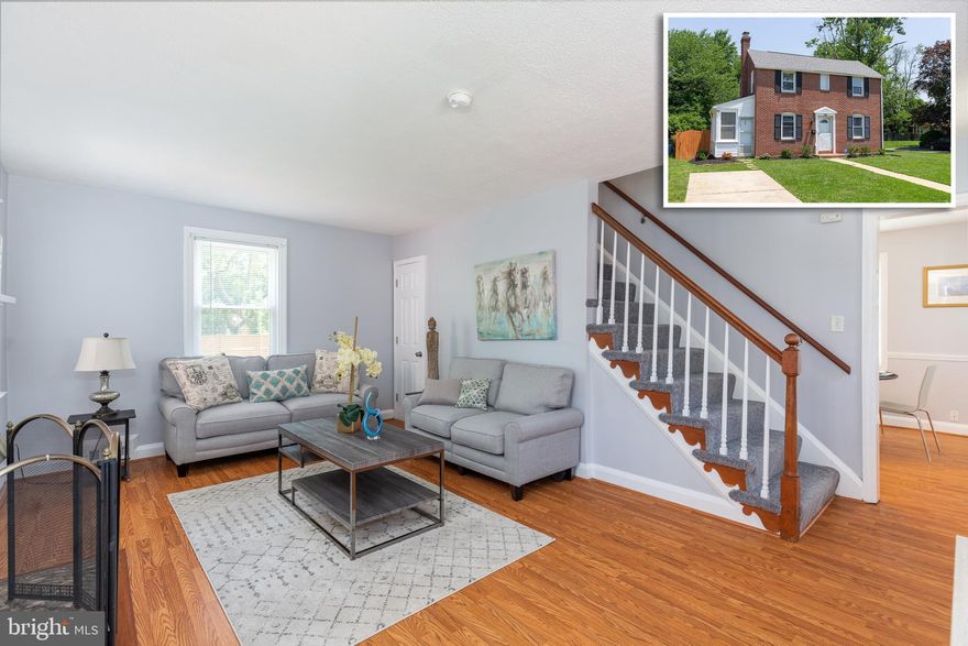 PICTURE PERFECT ALL BRICK COLONIAL WITH LARGE FENCED YARD!  Welcome home to this inviting home which features vinyl wood floors throughout the main level, a spacious living room w/ wood burning fireplace, large eat in kitchen w/ tile backsplash which leads to the sunroom, upper level w/ 3 bedrooms and 1 full bath, unfinished basement w/ half bath - perfect for storage or finish for more living space, large fenced yard, and driveway parking!