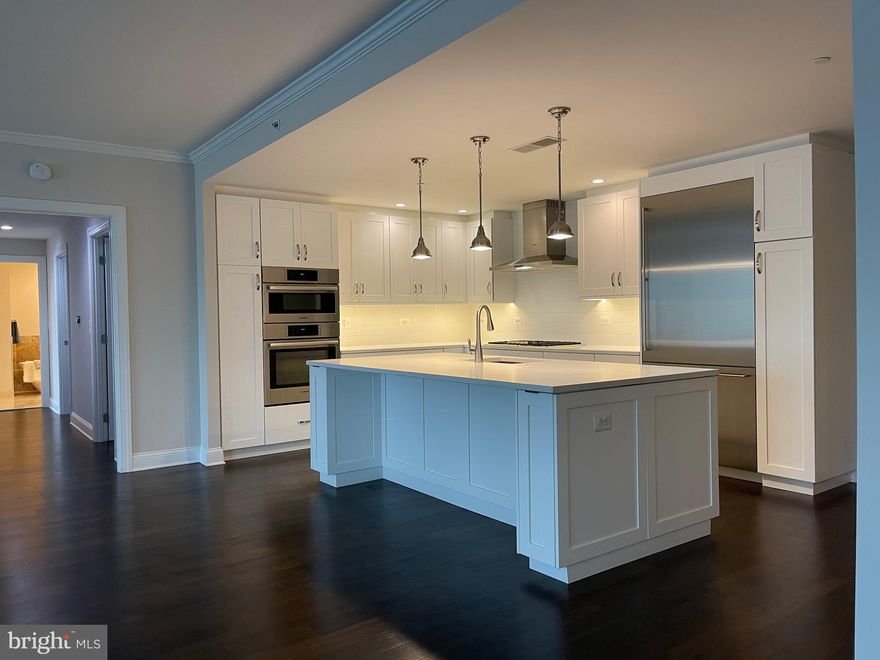 Oh just Wow! Dignified & Refined   just beautiful Hampden Row sprawling floor plan to Love with ginormous  Living & Dining and luxury Kitchen all open for todays lifestyle. Gagganeau & Bosch & white shimmering Quartz delights the eye. Bonus Den/Office too‼️ 3 huge California closet customized walk ins had  spared expense. Plus a refull size room for laundry and more storage. Terrific top roof deck - plenty of seating or grilling area.  Plus enhanced gym — in the heart of it all downtown New Bethesda  - practically next door to Metro 2 blocks away.