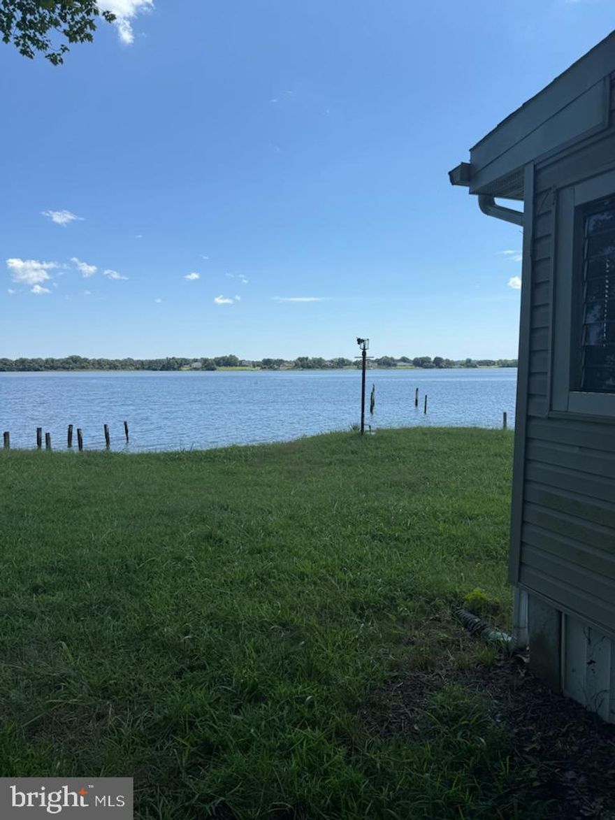 Unobstructed Views of the Patuxent River. Value is in the land. This property is being sold AS-IS. Build your dream home or rehab the property that is on site. Allow ample time for settlement. Parking pad adjacent to the property.