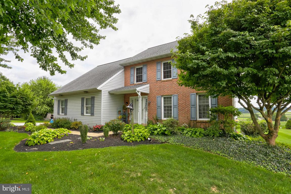 Gorgeous countryside views surround this perfectly located 4BR, 2.5 bath home in Lampeter-Strasburg schools! Just on the edge of Strasburg, relax on the covered deck or fire up the grill, and entertain guests overlooking those amazing views. Just a short walk to all that Strasburg has to offer! The home boasts cool central air, 2nd floor laundry, a large master suite with an extra large walk in closet, master suite bath with tile shower and glass surround, lots of natural sunlight, and the list goes on. The main floor expands to an open family room with a wood pellet stove nestled among a beautiful brick fireplace with built in features. The kitchen is equipped with