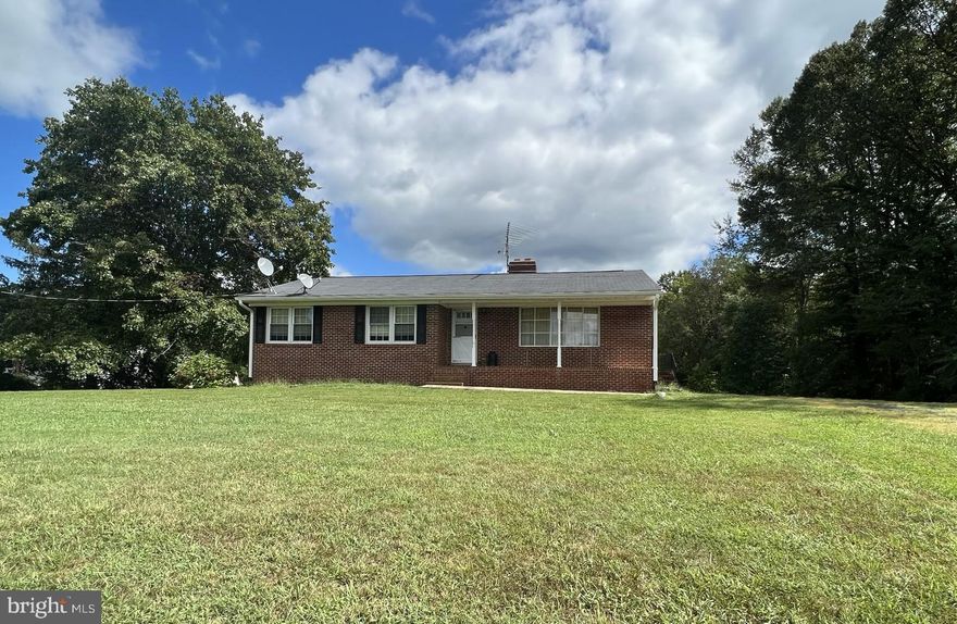 Great Solid Custom Built One Level Living!  3 bedroom 1full bath  Brick Rambler w/ Basement.  Main level  has the perfect family room with picture window looking out to the blue ridge mountains.   The  kitchen opens to the dining room with brick Fireplace off of the Florida room.     Steps go to down to the full walk out basement.  The  Utilities, Laundry Hook ups, and rough in located in the basement with multiple windows for lots of natural light make it perfect for future expansion.    Large rear yard for entertaining or whatever your county heart desires.   Enjoy the peacefulness of the Mountains , Farm and Pastural Views! The home has a recent replacement windows, a Newer Roof & HVAC.   Baseboard heaters were left for back up.  currently one bedroom has laundry hook ups but can easily be removed if desired.   There are cosmetic updates needed and an allowance is possible.   Do not miss out this opportunity!