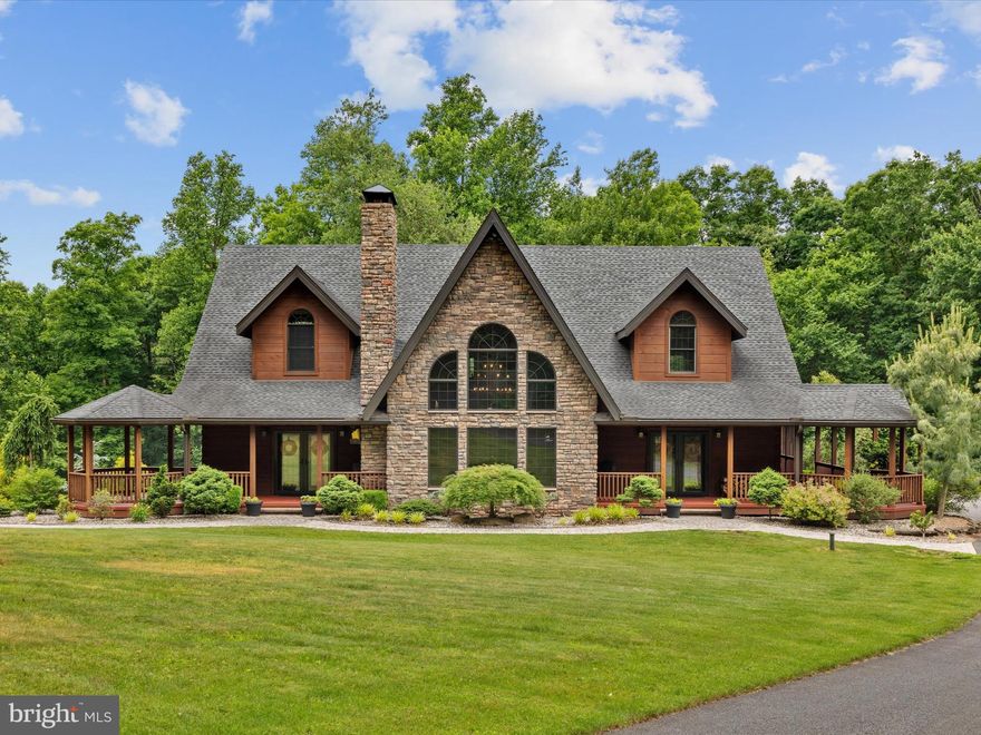 Spectacular Custom-Built Home Set on 60 Acres of Secluded Land! This hidden gem offers a peaceful retreat away from the hustle and bustle, surrounded by stunning natural beauty. Upon arrival, you'll be captivated by the tranquility and serene ambiance of this home. Enter through the front door to discover a spacious interior with striking post and beam construction. The main floor welcomes you with warm pine floors that extend seamlessly throughout the home. The great room's large distinctive windows flood the space with natural light, showcasing the exposed stone walls and elk antler chandelier. The gourmet kitchen is a chef's dream, featuring custom handmade cabinetry, high-end Viking appliances, a commercial range, an ice maker, a wine cooler, and elegant granite countertops. Adjacent to the kitchen, the octagonal breakfast room offers breathtaking views of the woodland surroundings. Step outside to your private haven, where a 35 x 18 screened-in porch invites you to relax in the gentle breeze. The primary bedroom on the first floor is a serene retreat, boasting a log beam ceiling, two walk-in closets, and a luxurious private bathroom. Upstairs, two spacious bedrooms offer privacy, along with an additional loft that extends the living space and is perfect for an entertainment area. Descend to the basement, which is already roughed in and framed for a future bath and expansive bar area. But that's not all! Auto enthusiasts will delight in the 100' x 50' outbuilding with heated insulation and radiant floor heat, offering space for up to 16 cars or any other storage needs. Wildlife lovers will appreciate the abundance of deer and turkeys roaming the property. If you're seeking a unique property immersed in nature, perfect for hiking, hunting, or simply enjoying the outdoors this is a rare find and close proximity to major arteries (just 10 minutes from the Pennsylvania Turnpike). Experience this property for yourself and schedule your showing today!