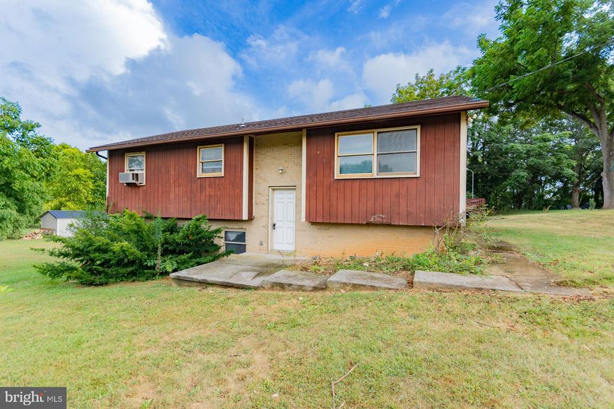 Unlock the potential of this 1975 split foyer home offering solid bones and unique features waiting to be rejuvenated.   Situated on a .81 acre lot with no HOA restrictions, this is a gem for savvy investors and renovators.  This property is being sold "as is", offering a blank canvas for those with vision and craftmanship to restore or reimagine.    With three bedrooms and two full baths, this property has unique features with exciting possibilities for modern upgrades. The main level features hardwood floors throughout.  The eat in kitchen is complete with range, refrigerator, and dishwasher.  The open concept of the living and dining room combo with sliding doors leading to the rear deck and pool area  is ideal for entertaining. 
The primary bedroom offers a private bathroom.  The second bedroom has a hot tub room adding a touch of luxury and relaxation.  The third bedroom has private deck access for a touch of personal privacy.  
The deck surrounds an above ground pool that can be the focal point of your reconstruction vision.  
The large lot offers ample space for future additions, landscaping upgrades, or even a potential "tiny house".  
The large unfinished basement offers a blank canvas ro create additional living space, a home office, or rental space.  The orignial lay out provides flexibility for redesign and customization.  

Whether you're an investor looking for your next flip or a renovator ready to bring fresh life to a well-loved home, this property is packed with promise. With a little vision and elbow grease, it could become the neighborhood gem.